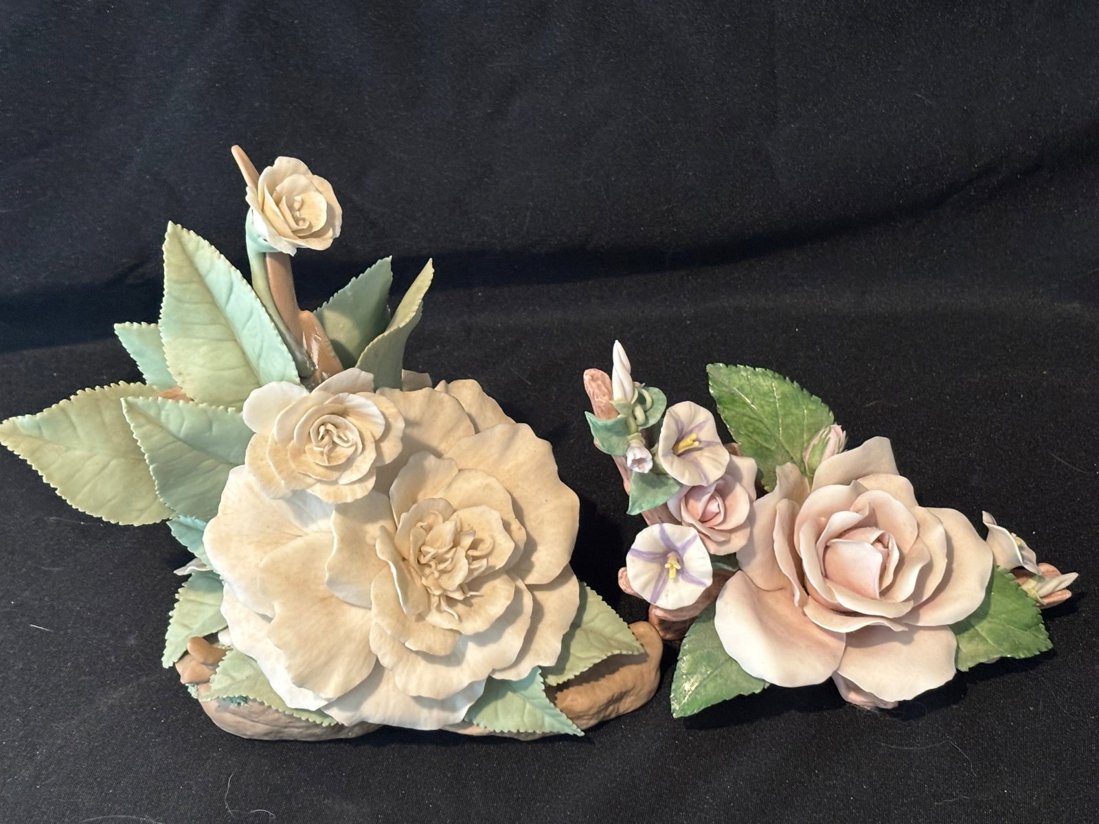 Two similar vintage Cybis porcelain rose sculptures: Two vintage Cybis porcelain rose sculptures. This specific model is a collectible bisque porcelain floral arrangement featuring a fully bloomed cream/yellow rose, an accompanying smaller rosebud clust