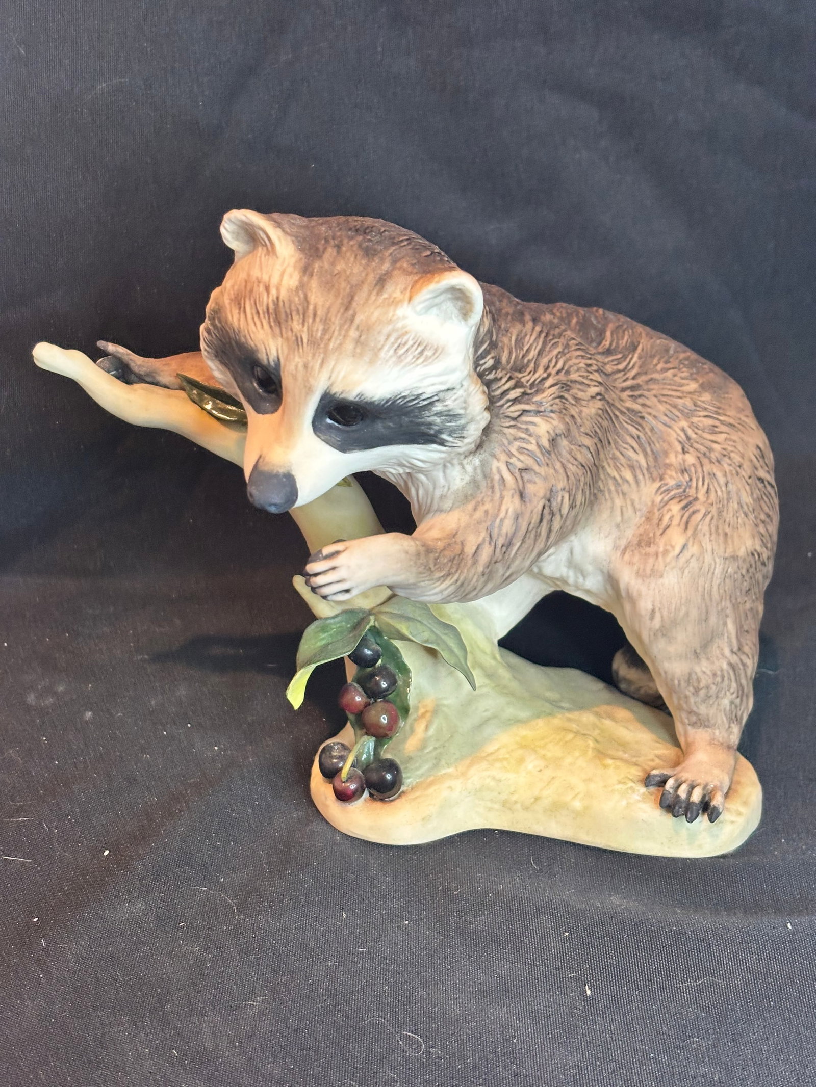 Cybis "Raffles the Raccoon," 7 inch figurine: "Raffles the Raccoon," a fine bisque porcelain figurine created by the renowned Cybis Porcelain Art Studio.Key Details About the PieceIntroduction & Style: First introduced around 1965. It features a 