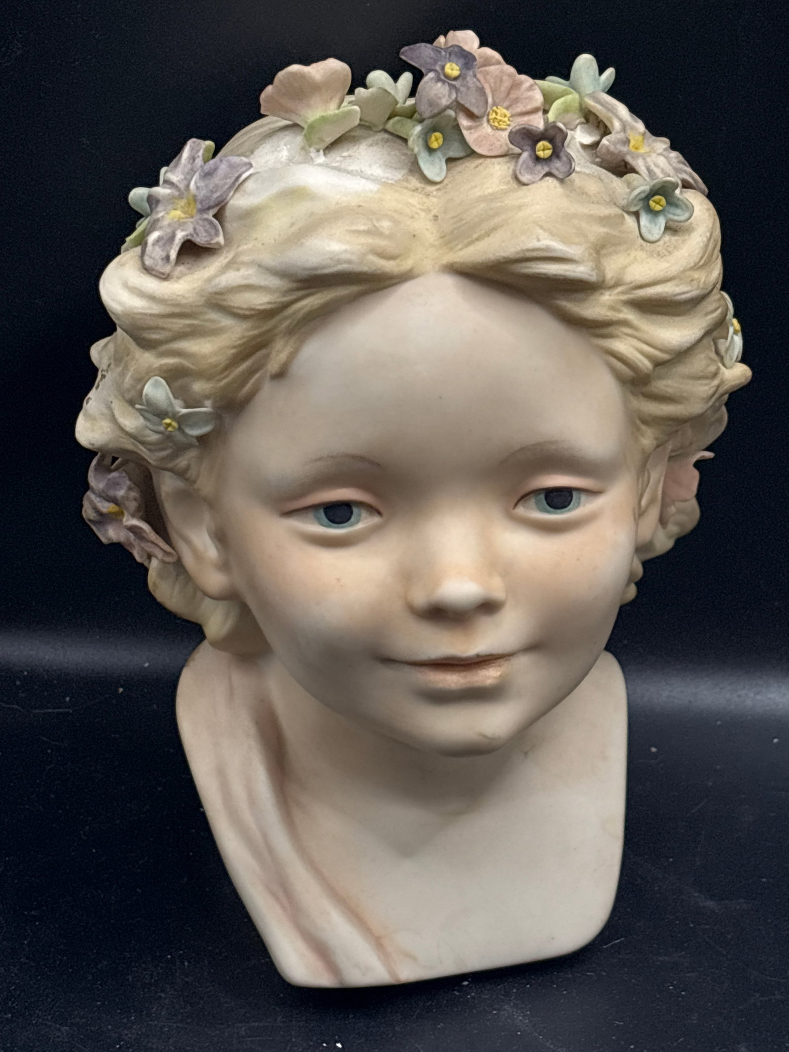 Cybis "Robin" (Girl's Head with Flowers)10&3/4 inch figurine: vintage porcelain bust sculpture titled "Robin" (Girl's Head with Flowers) by the Cybis porcelain studio.DetailsMaker: CybisDesign: A young girl with delicate pastel porcelain flowers woven into her h