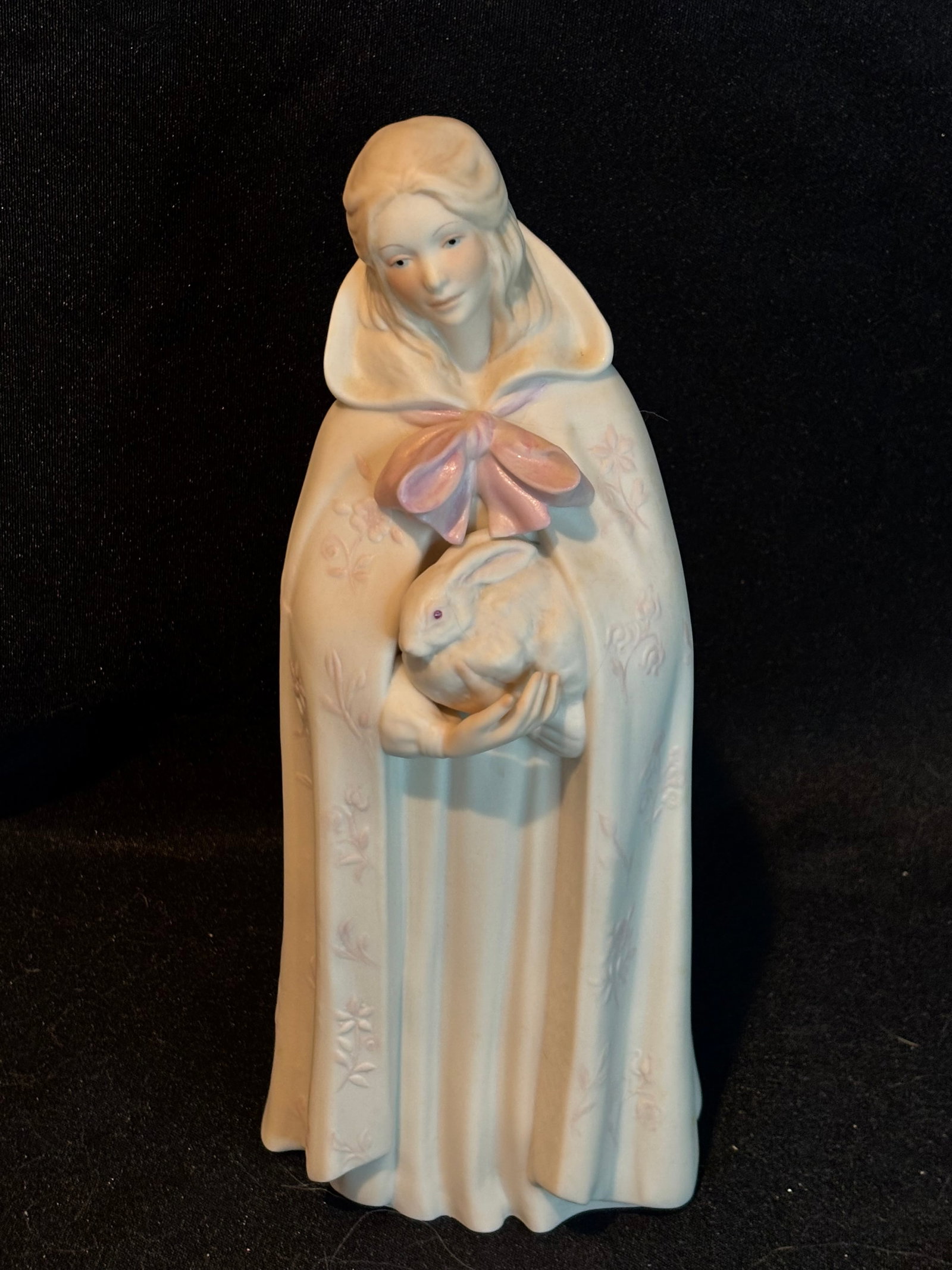 Cybis porcelain figurine titled "Melissa" (or "Melissa Shelters the Timid Hare"): Cybis porcelain figurine titled "Melissa" (or "Melissa Shelters the Timid Hare"), introduced in 1976.DetailsMaker: CybisName: MelissaTagline: "Melissa shelters the timid hare and gentle creatures ever