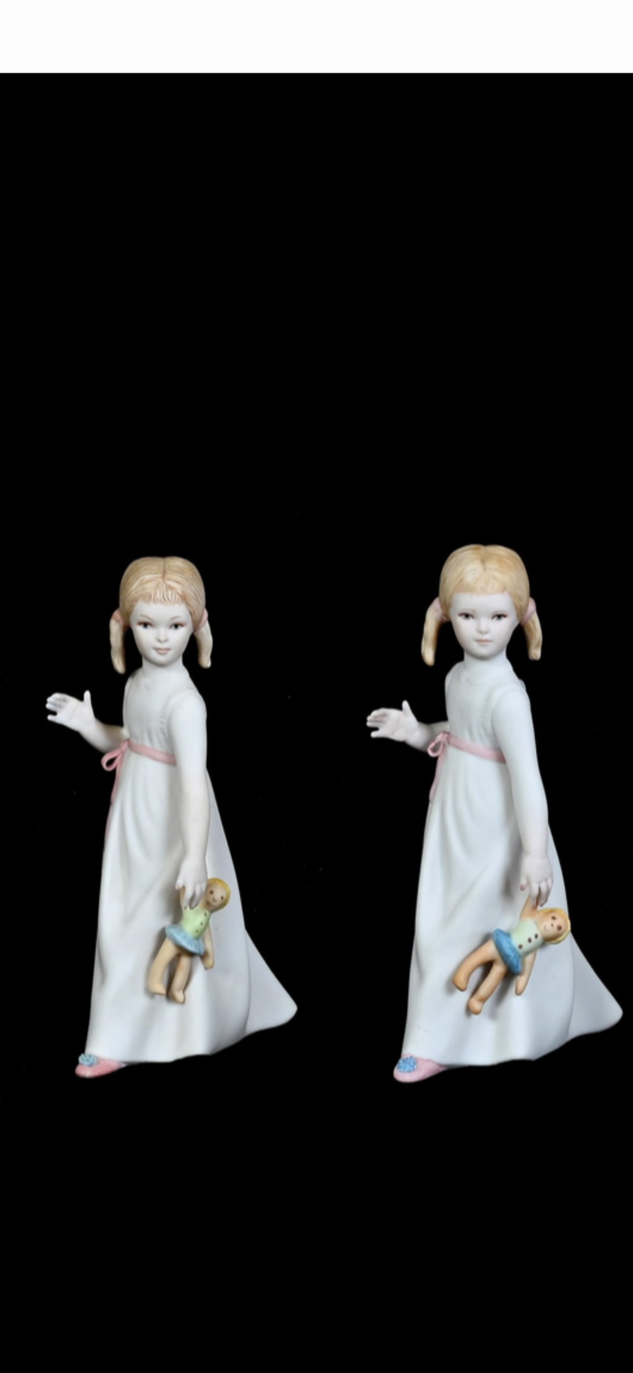 Two Cybis vintage matte porcelain figurine of Wendy from Peter Pan: Two vintage matte porcelain figurine of Wendy from Peter Pan holding a small doll, created by Cybis.Artist/Maker: Cybis Porcelains (introduced around 1957)Subject: Wendy from Peter Pan holding a doll,