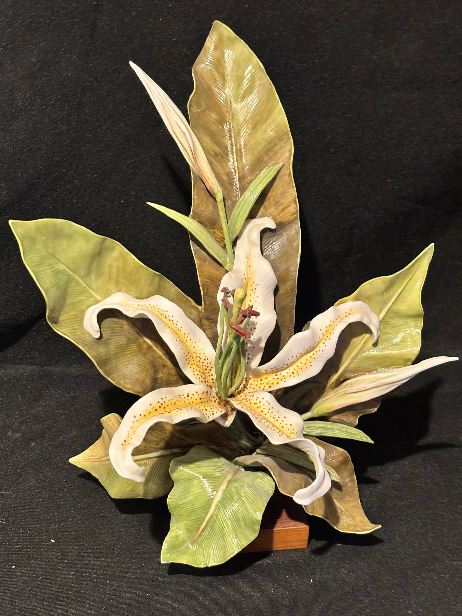 Lacking bottom petal ; Cybis Porcelain collection "Golden Clarion (Lily)": "Golden Clarion (Lily)" produced by Cybis Porcelain.About the PieceRelease & History: This delicate study was introduced in 1961 and completed in 1966, with final shipments concluding around 1970.Limi
