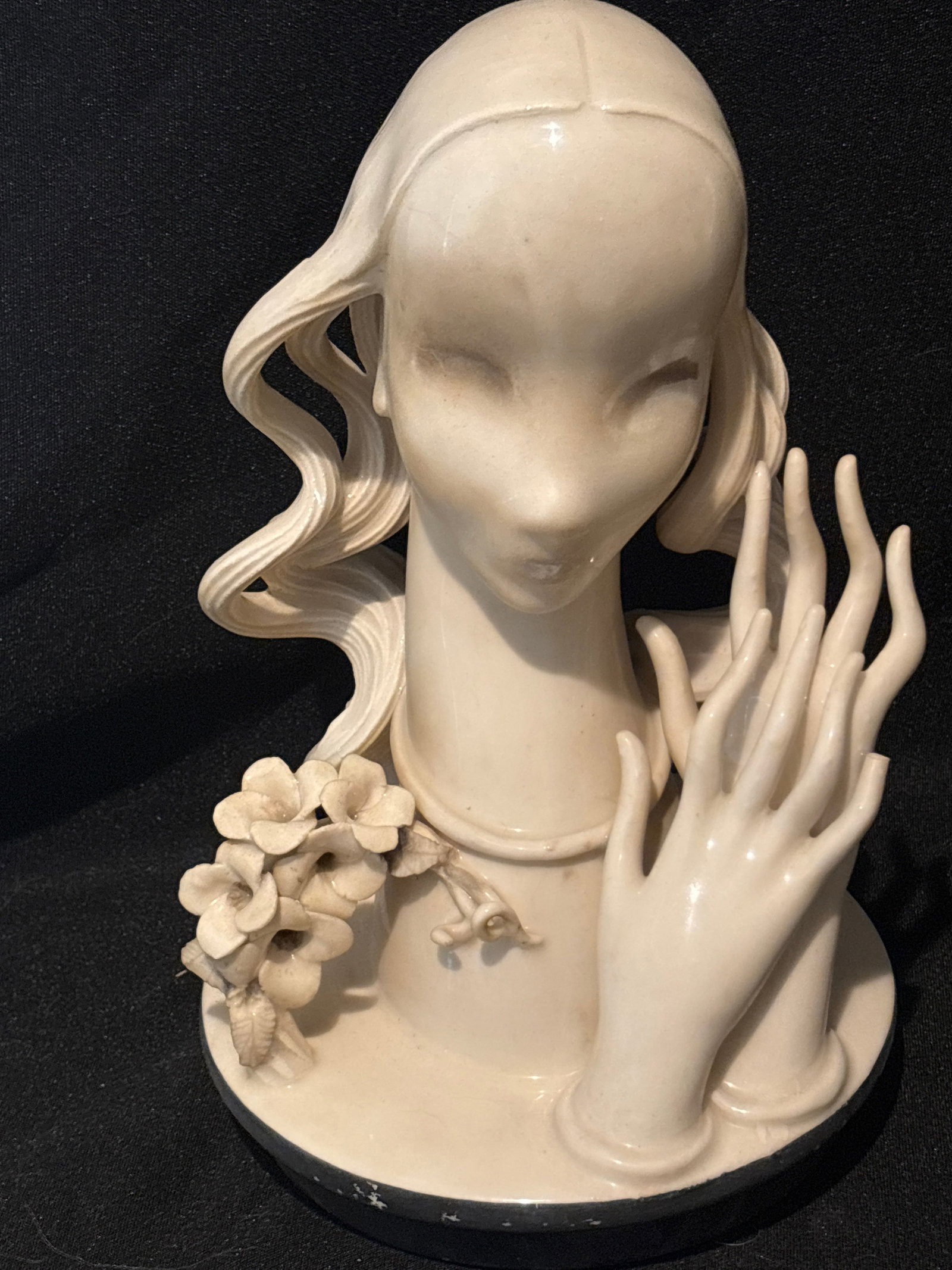 Broken finger; Cybis rare 1940s porcelain female bust: rare 1940s porcelain female bust manufactured by the Cybis porcelain studio.Design ProfileStyling: This specific style features a highly smooth, minimalist face combined with intricate, hand-molded lo