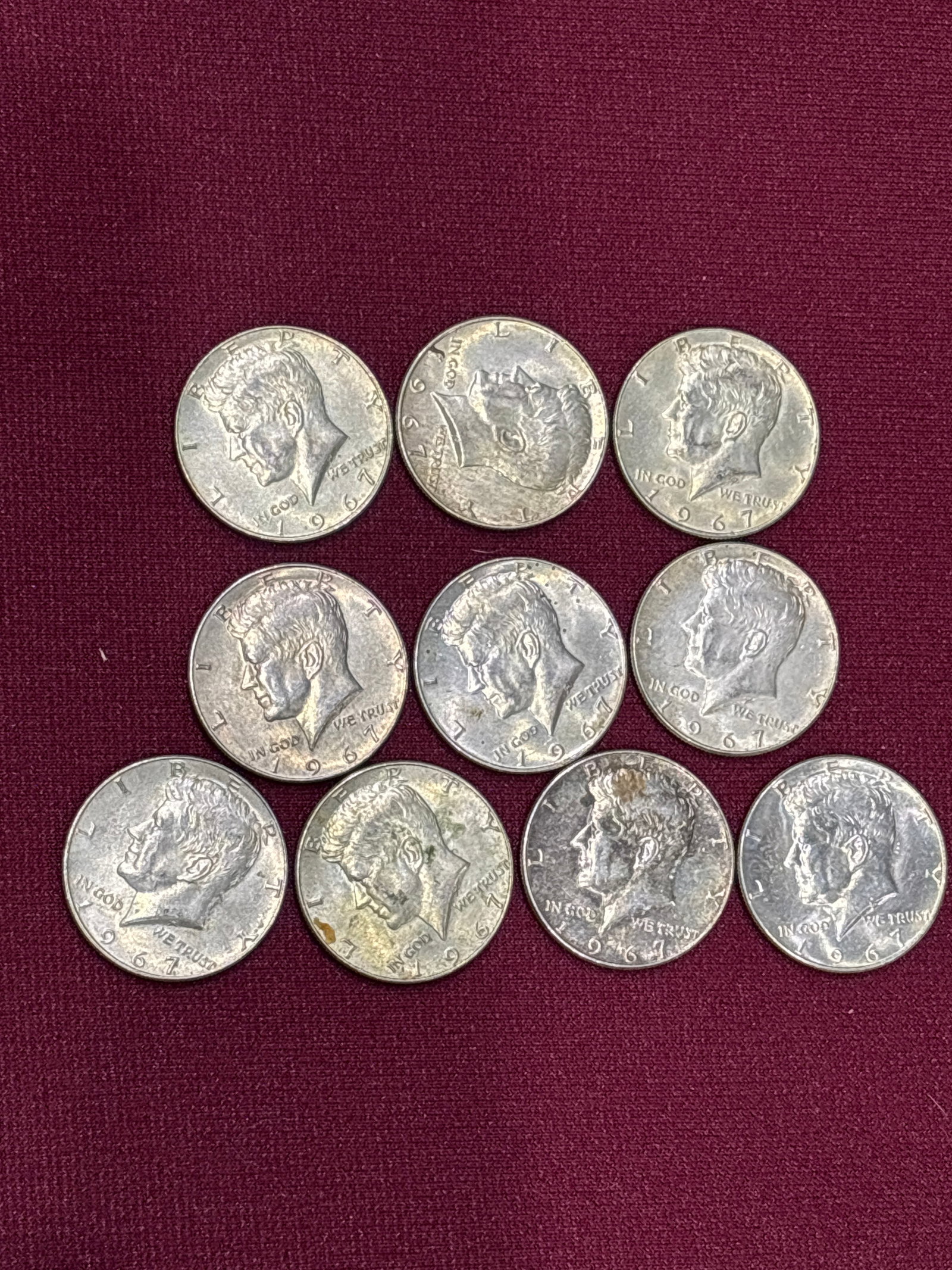 Ten 1967 US Kennedy Half Dollars; composed of 40% silver: 1967 US Kennedy Half Dollar, which is known to be composed of 40% silver.While typical circulated examples may be worth slightly more than their silver content, special versions such as the "Double Di