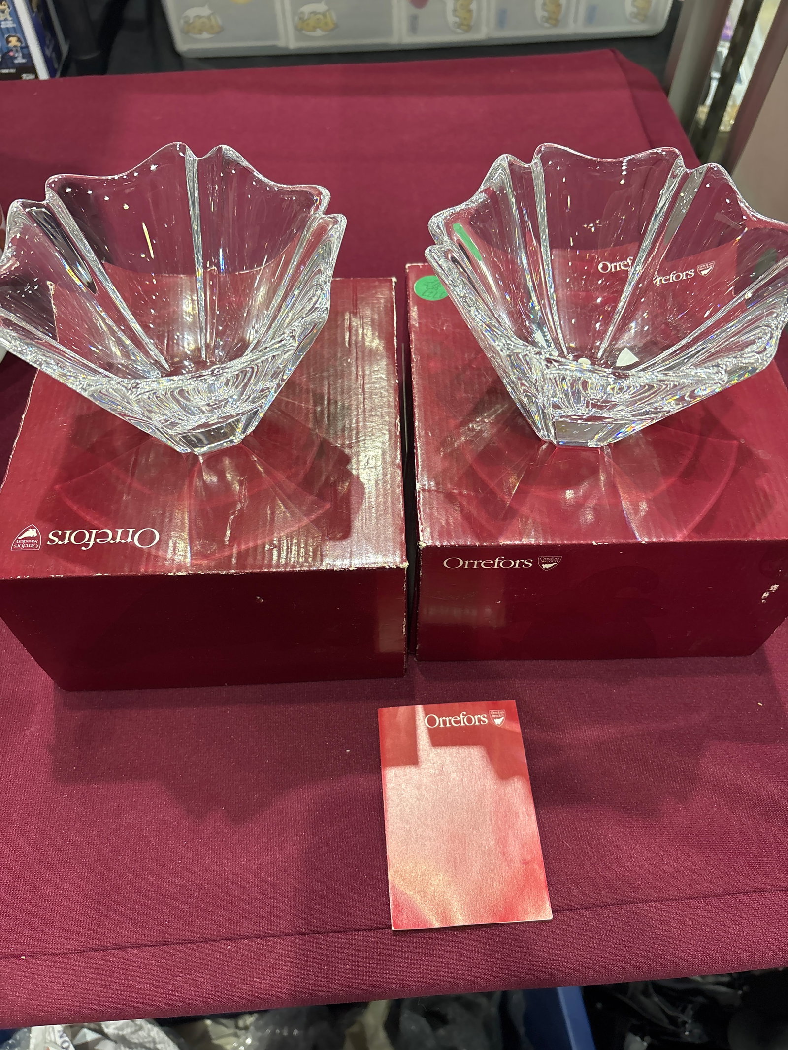 Pair of Orrefors Orion crystal bowls designed by Lars Hellsten: Pair of Orrefors Orion crystal bowl designed by Lars Hellsten.It features a flower-shaped, 6-petal design and is crafted in Sweden.The bowl is typically found signed by the designer and often comes in