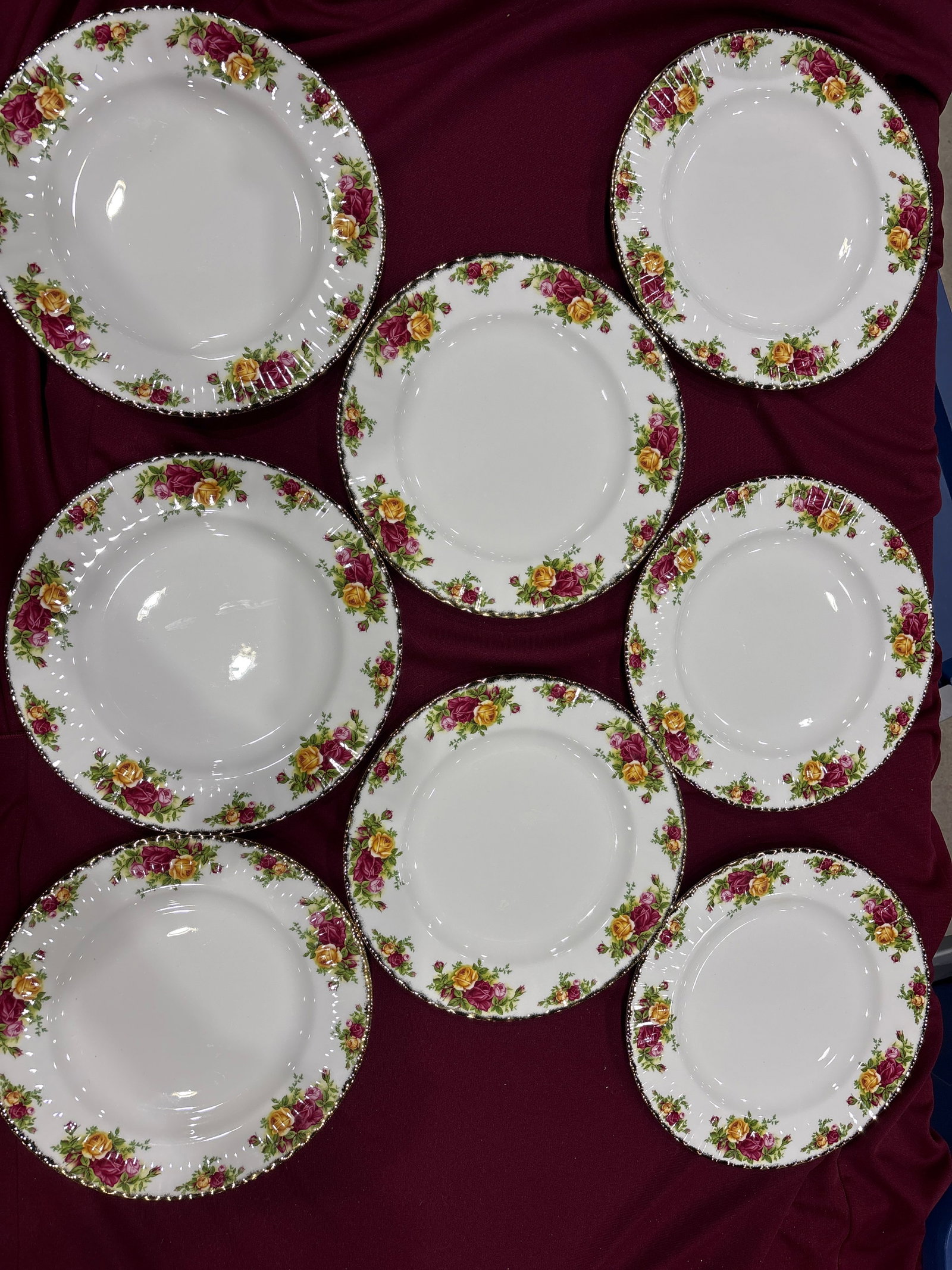 Set of eight Royal Albert Old Country Roses porcelain 10&1/4 inch dinner plates: Set of eight Royal Albert Old Country Roses porcelain 10&1/4 inch dinner plates featuring a classic floral motif and gold edging.The pattern, launched in 1962, is characterized by burgundy, pink, and 