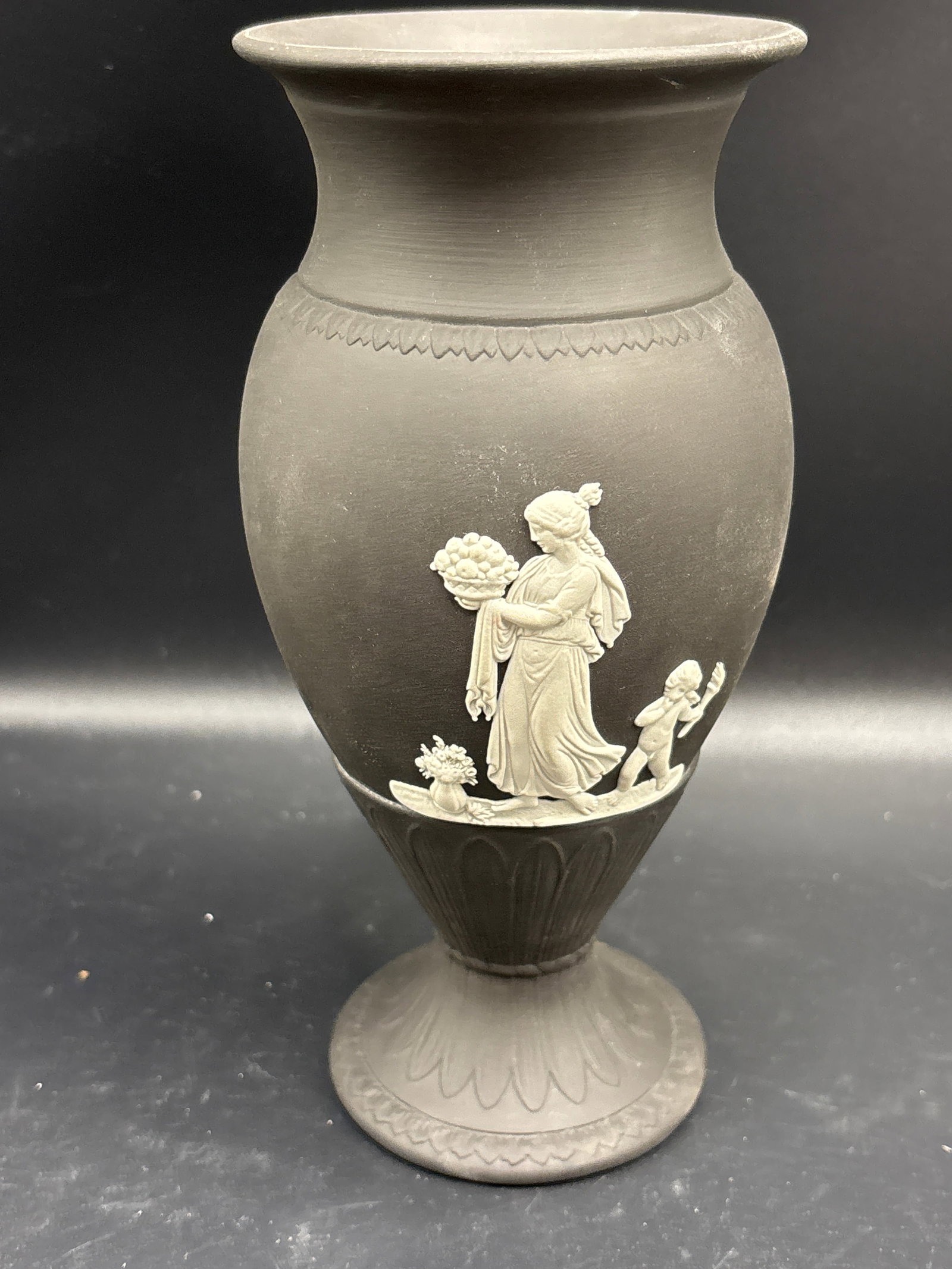 signed vintage Wedgwood Jasperware black basalt with white relief 7 in b vase: signed vintage Wedgwood Jasperware bud vases in black basalt with white classical relief detailing.The vases typically feature cherubs or pastoral scenes inspired by ancient Greek and Roman art.Indivi
