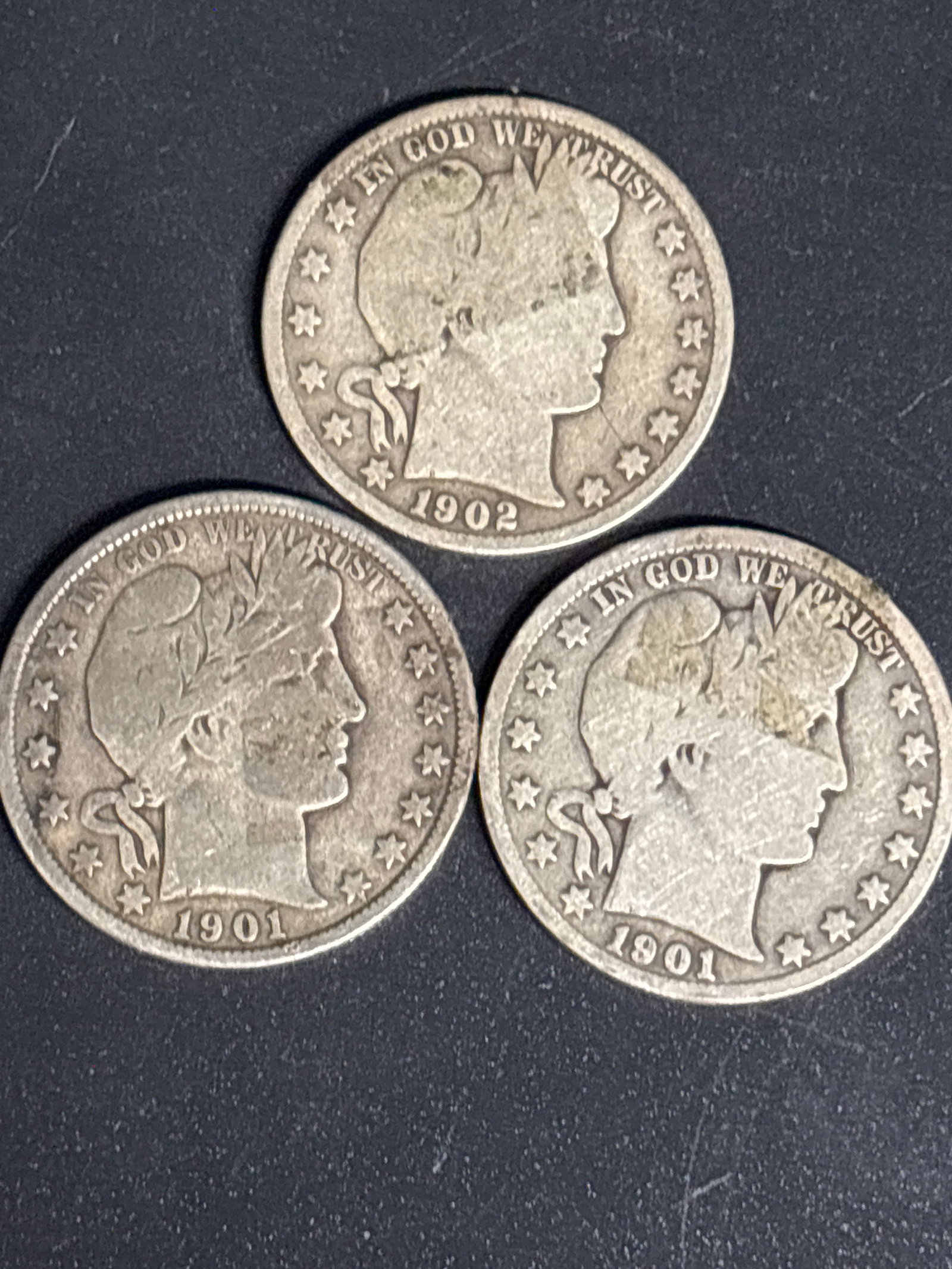 Group of three early Silver U.S. Barber Half Dollars: Group of three early Silver U.S. Barber Half Dollars, minted between 1892 and 1915.It is composed of 90% silver.The value depends on the year, mint mark, and condition, with some circulated examples l