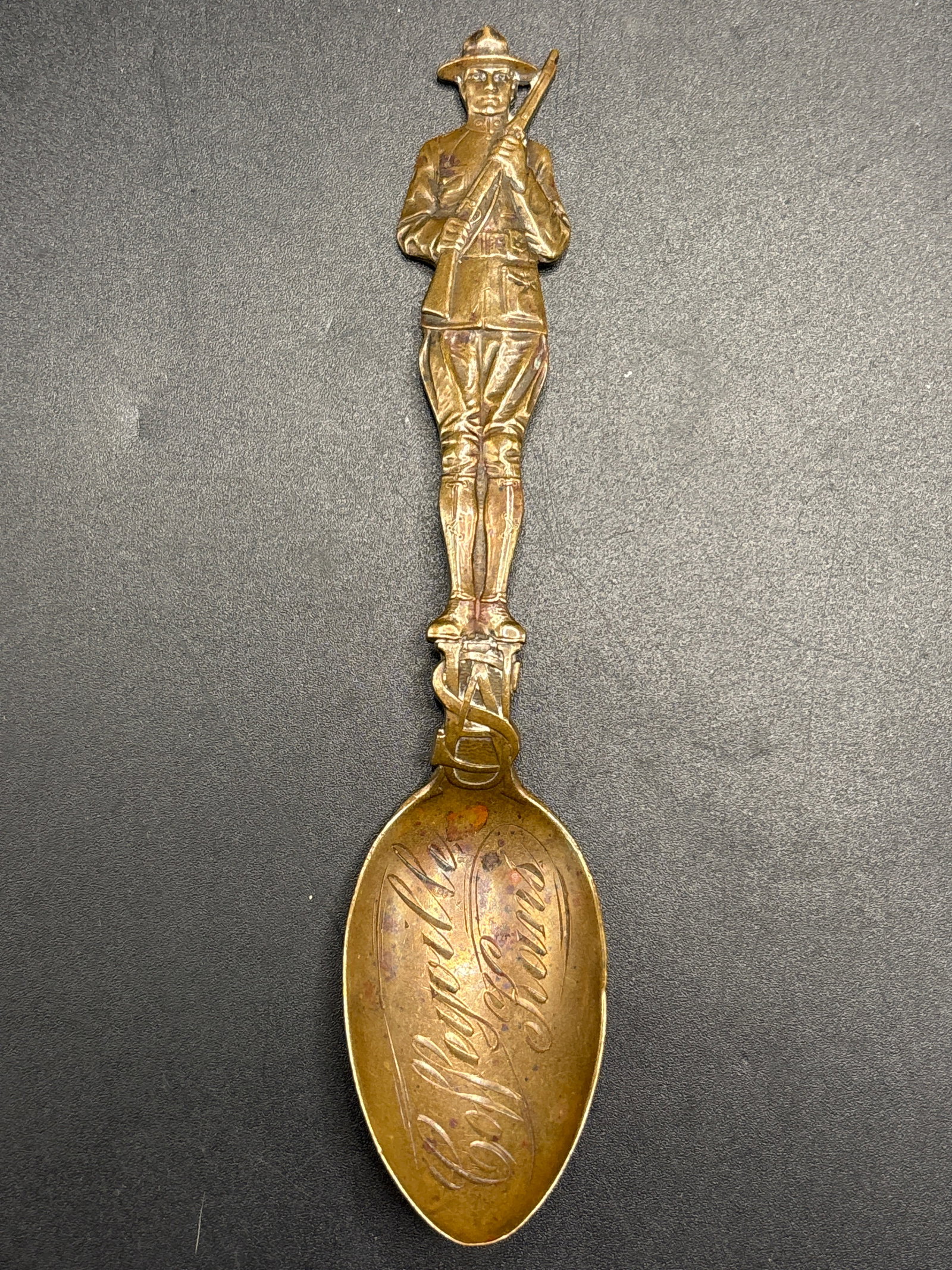 Rare antique ‘Coffeyville, Kansas soldier form bronze 5&3/4 inch spoon: Rare antique souvenir spoon featuring a figure of a soldier or miner on the handle.The bowl of the spoon is engraved with text, potentially indicating a location such as "Coffeyville, Kansas".Similar