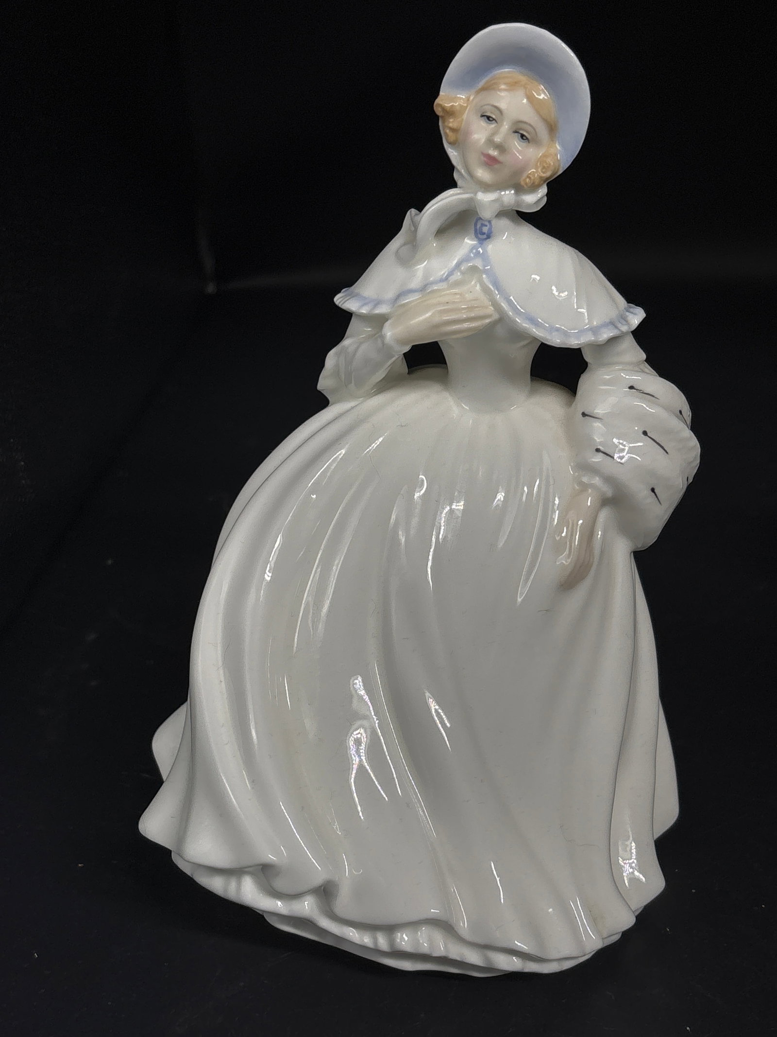 Royal Doulton England HN3497 Jessica bone china porcelain lady 7.5 inch figurine: 1987 Royal Doulton, New Colourway 1993 modelled by Peggy Davis.Royal Doulton HN3497 Jessica bone china porcelain lady, featuring a white dress and blue cape.Model Number: HN3497Production Year: 1993Di