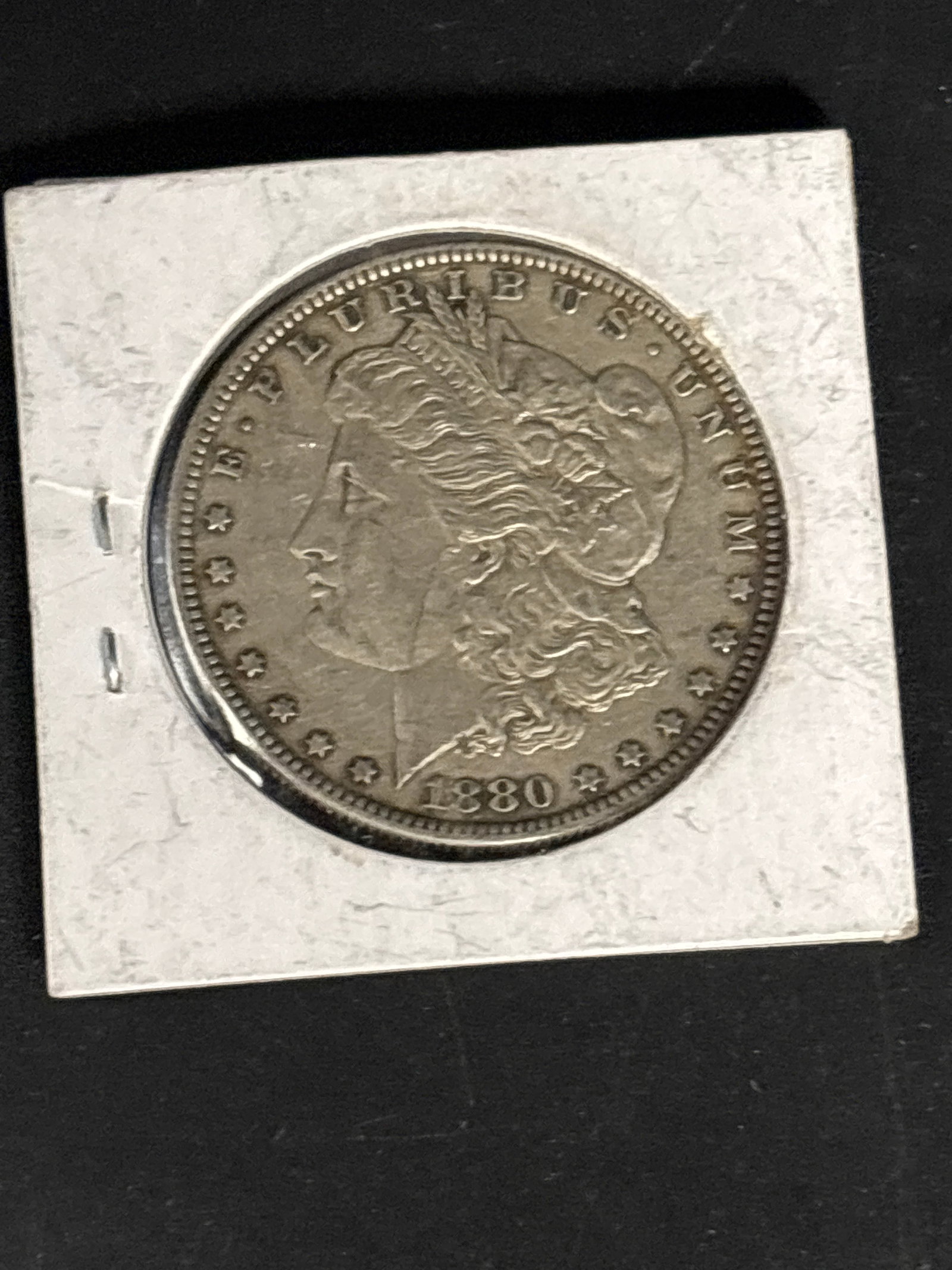 Original United States 1880 Morgan Silver Dollar: Original United States 1880 Morgan Silver Dollar, an iconic 90% silver coin designed by George T. Morgan.
