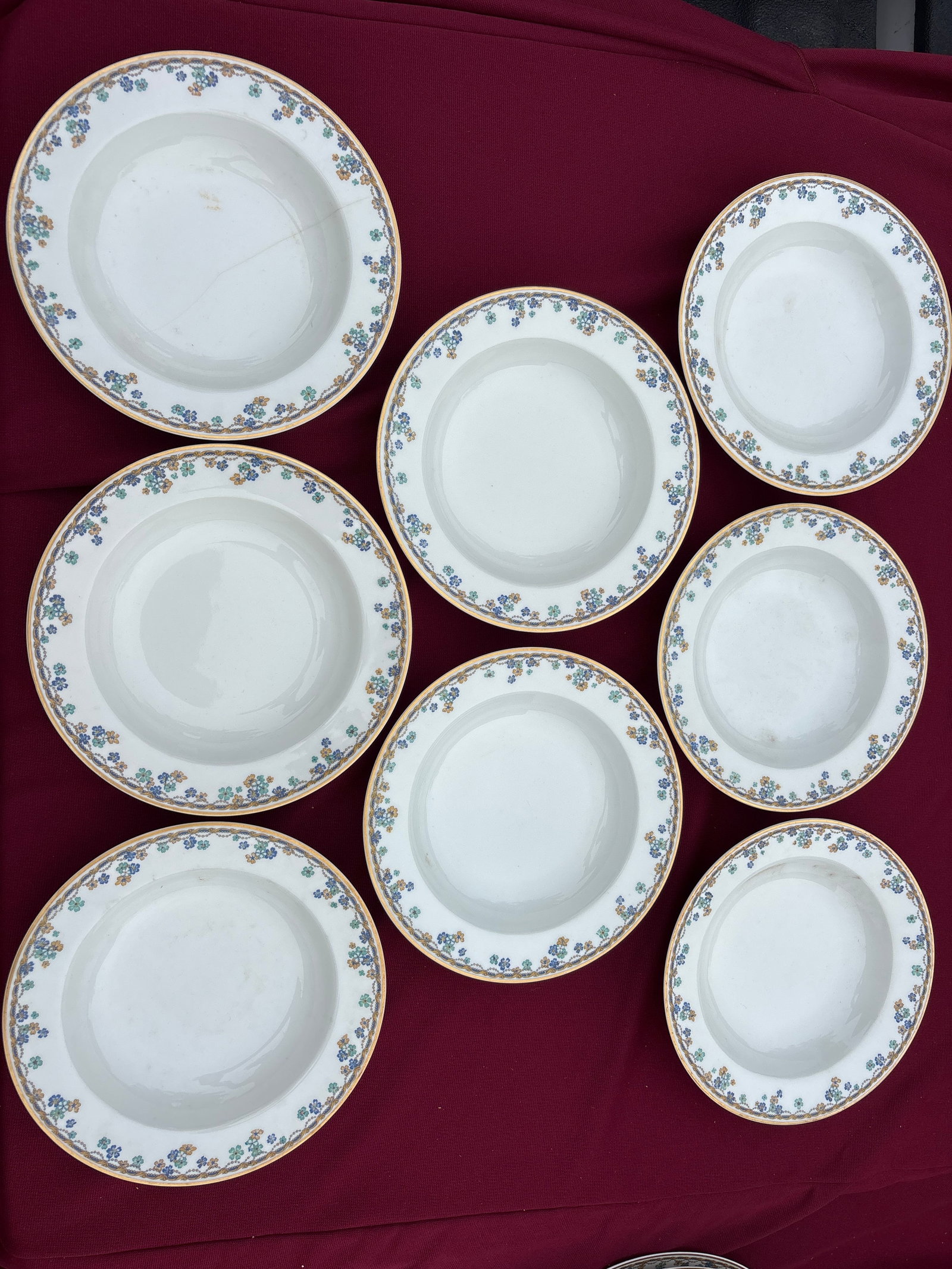 Set of eight Haviland Limoges France Vincennes pattern 7&1/2 inch rimmed bowls: Set of eight Haviland Limoges France Vincennes pattern rimmed bowls featuring a delicate floral and scroll border with gold trim.The pattern, often listed as Schleiger 108, includes blue and yellow fl