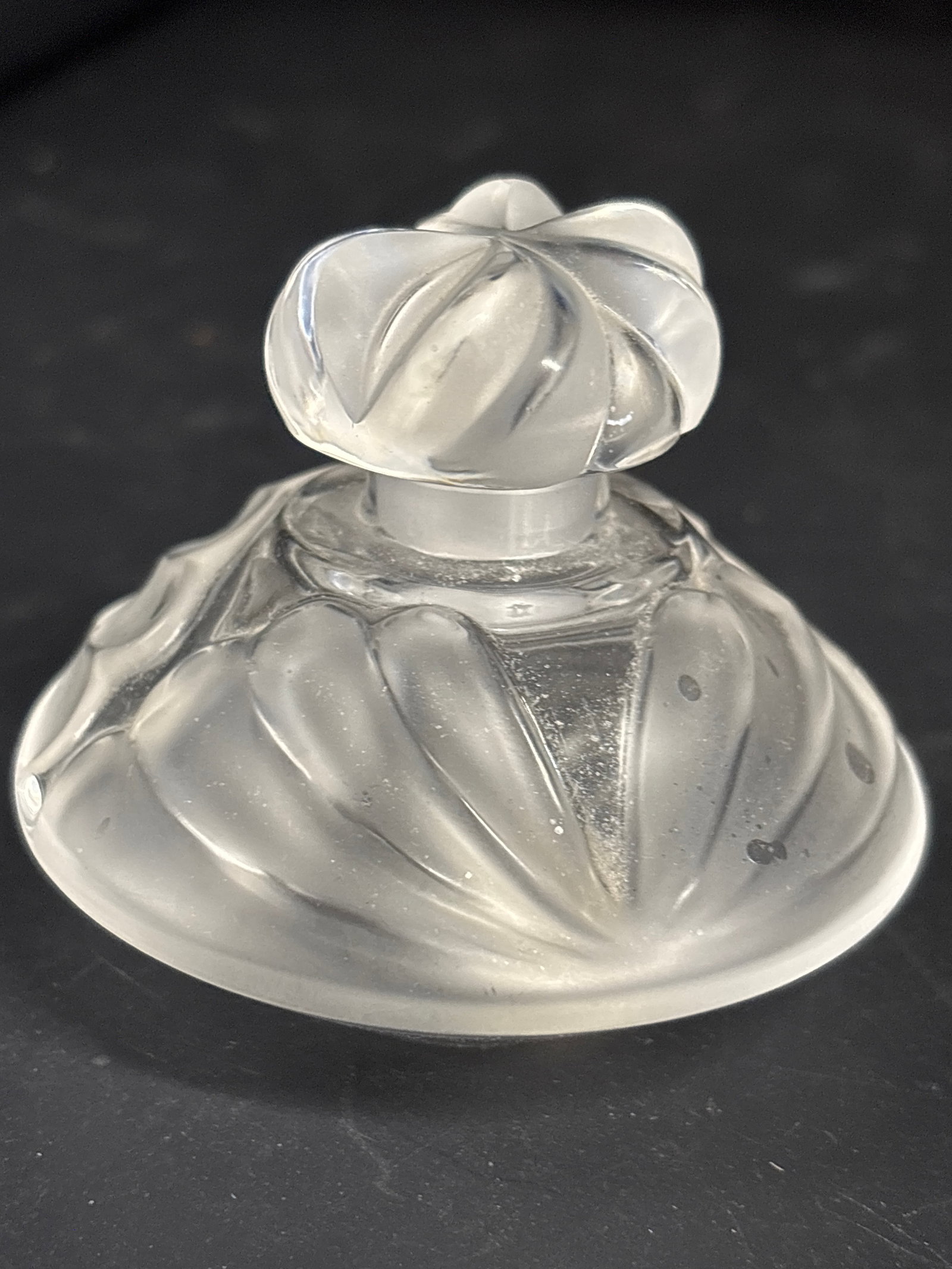 Original vintage Lalique "Thais" crystal 3 inch perfume bottle: vintage Lalique "Thais" crystal 3 inch perfume bottle with stopper designed by Marie-Claude Lalique in 1979.The stopper features a frosted and clear crystal swirl design that is characteristic of this
