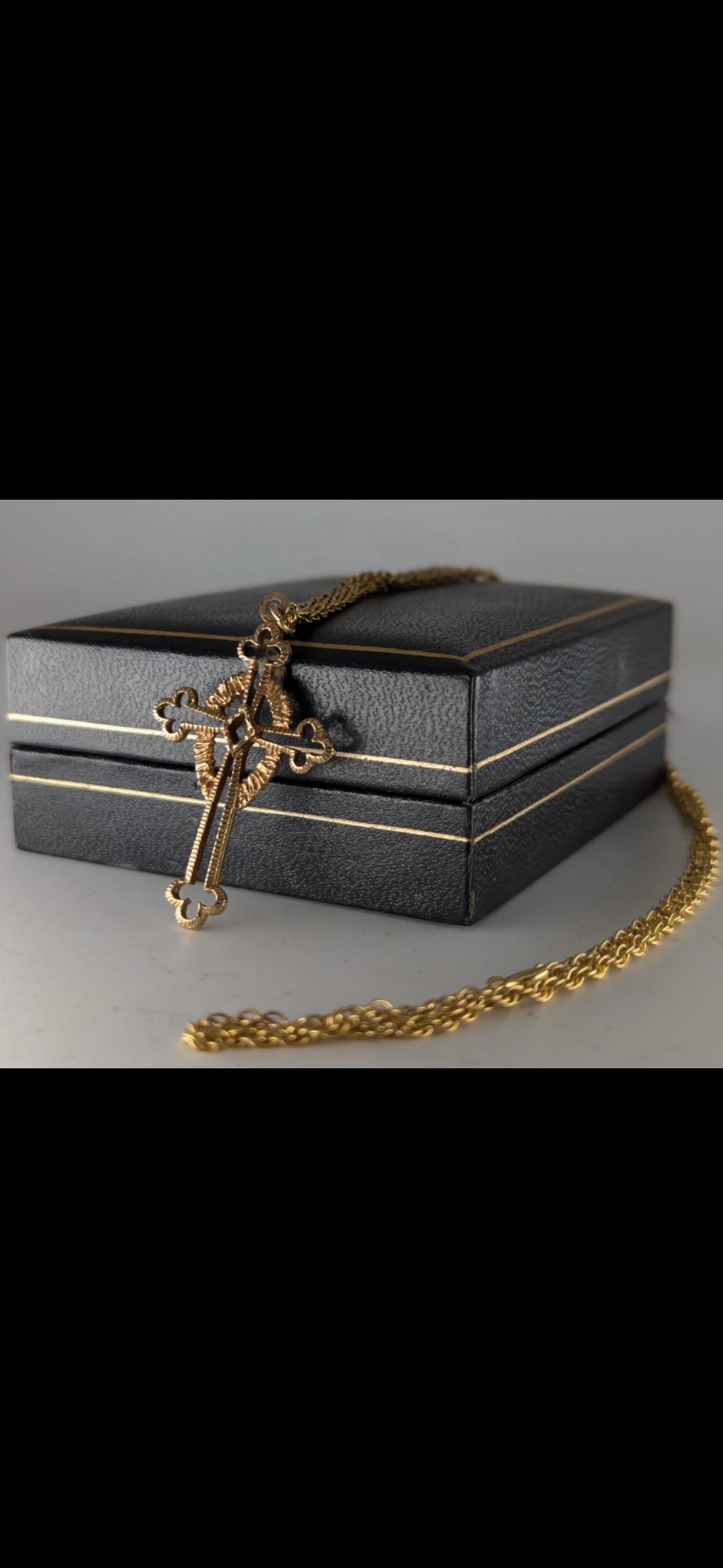 8.8 grams 9k yellow gold Celtic cross pendant and chain necklace; 22 inches: 9ct gold crucifix/cross and chain, 8.8gMore InformationChain 56cm long. Crucifix approximately 4cm high9k yellow gold Celtic cross necklace, characterized by its traditional ringed design intersecting