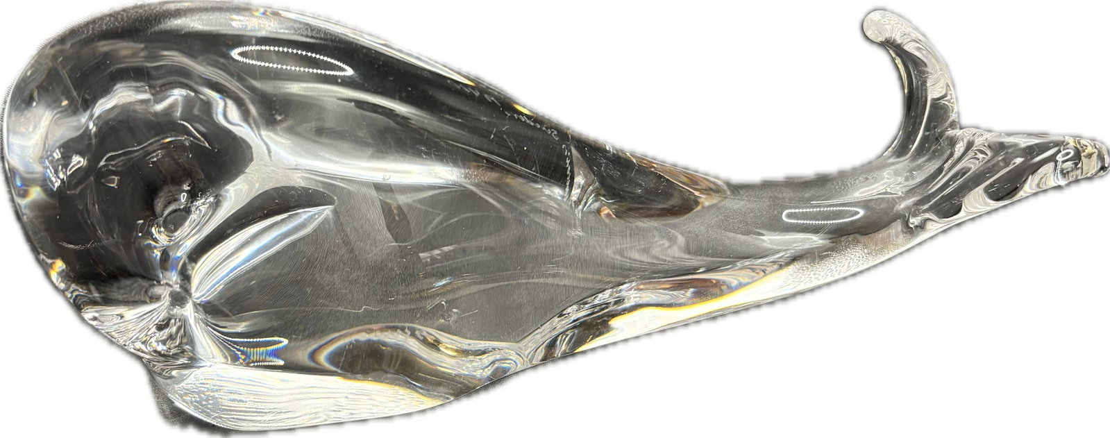 "Kosta", Lindstrand 8 inch whale form crystal sculpture: "Kosta" hand-etched on the left flank of the base, matched with "Lindstrand" running along the opposite side.Model Line: This specific organic, sleek form corresponds to the mid-century modern animal 