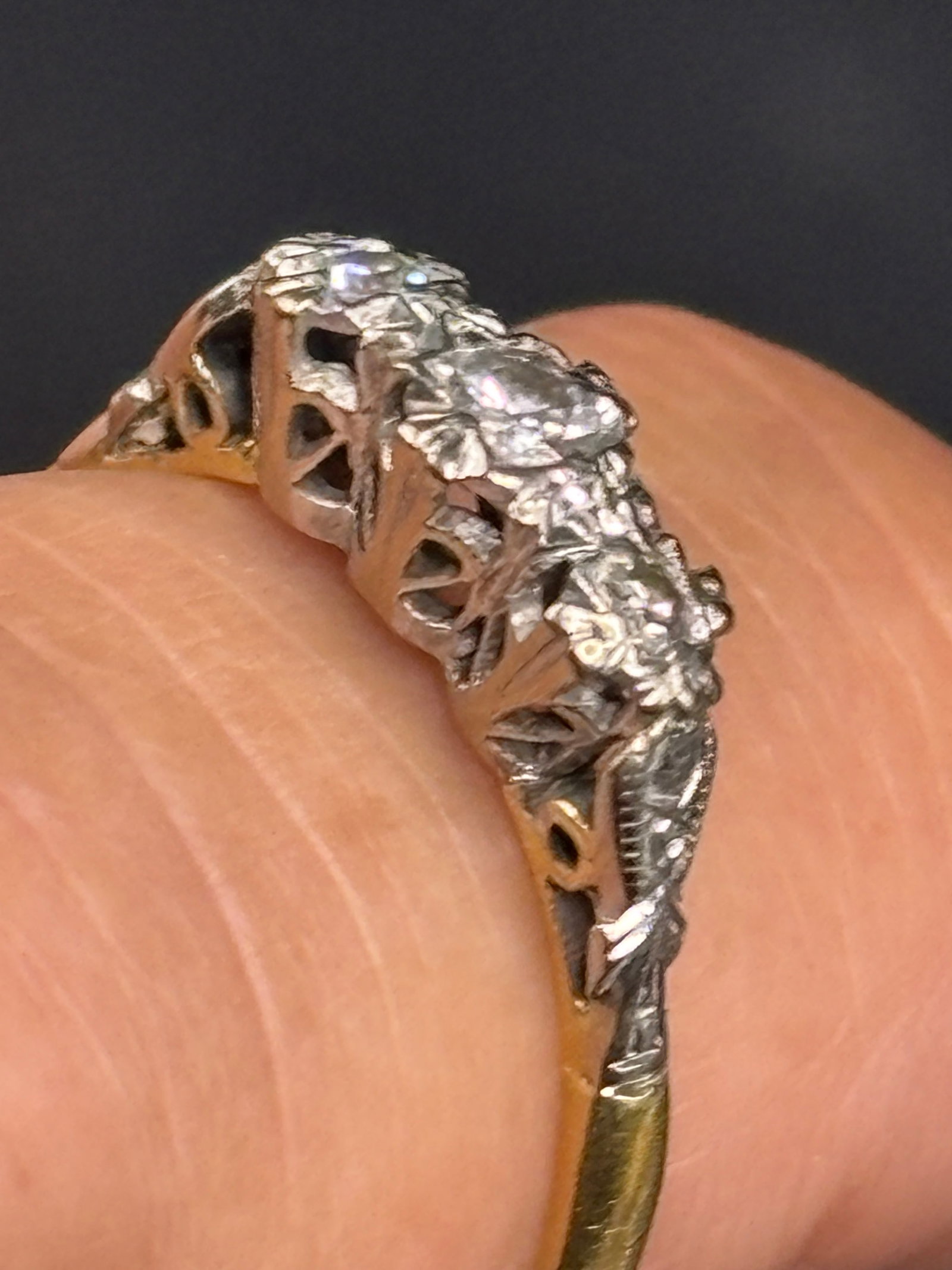 Beautiful 3 grams 18k yellow gold old European cut diamond trilogy ring: beautiful antique 3 grams 18k yellow gold diamond trilogy ring, an elegant three-stone configuration symbolizing past, present, and future.Ring & Gemstone DetailsMetal Composition: Crafted in rich 18k