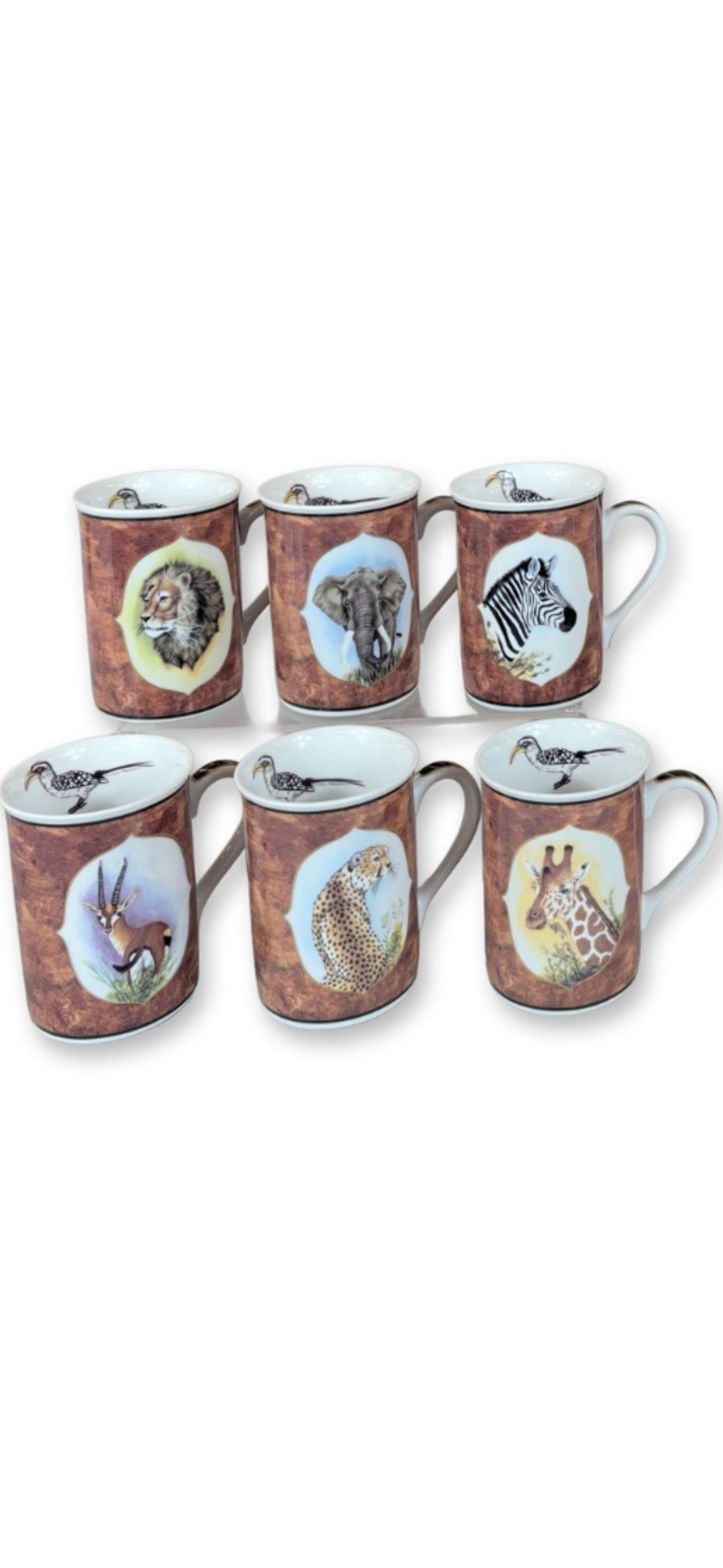 Set of six Lynn Chase Designs "African Portraits" porcelain mugs 4.25 inch: Set of six Lynn Chase African Portraits mugs featuring various safari animal designs with 24k gold trim.The collection includes portraits of animals such as a lion, elephant, zebra, gazelle, leopard, 