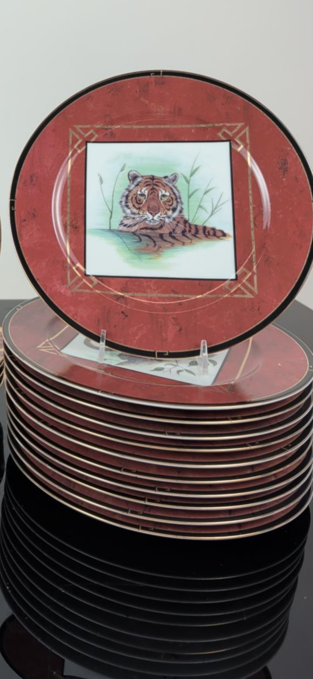 Set of eleven Lynn Chase Designs "Asian views’ porcelain 9 inch plates: Set of eleven Lynn Chase Designs collection of porcelain plates in the Asian Views and African Portraits patterns. The 11plates in the Asian Views series, dated 1998, features red marbleized borders