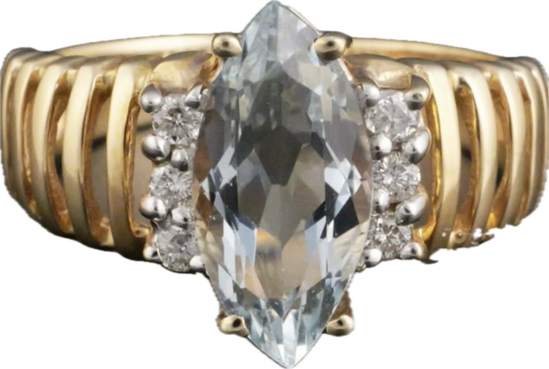 2.8 grams 10k gold ring with 12mm topaz flanked by six diamonds: 10k YG ring with 12mm topaz flanked by six diamonds. Size 6. Weighs 2.8 grams. vintage ring features a marquise-cut aquamarine center stone set in yellow gold.Primary Gemstone: Marquise-cut aquamarine