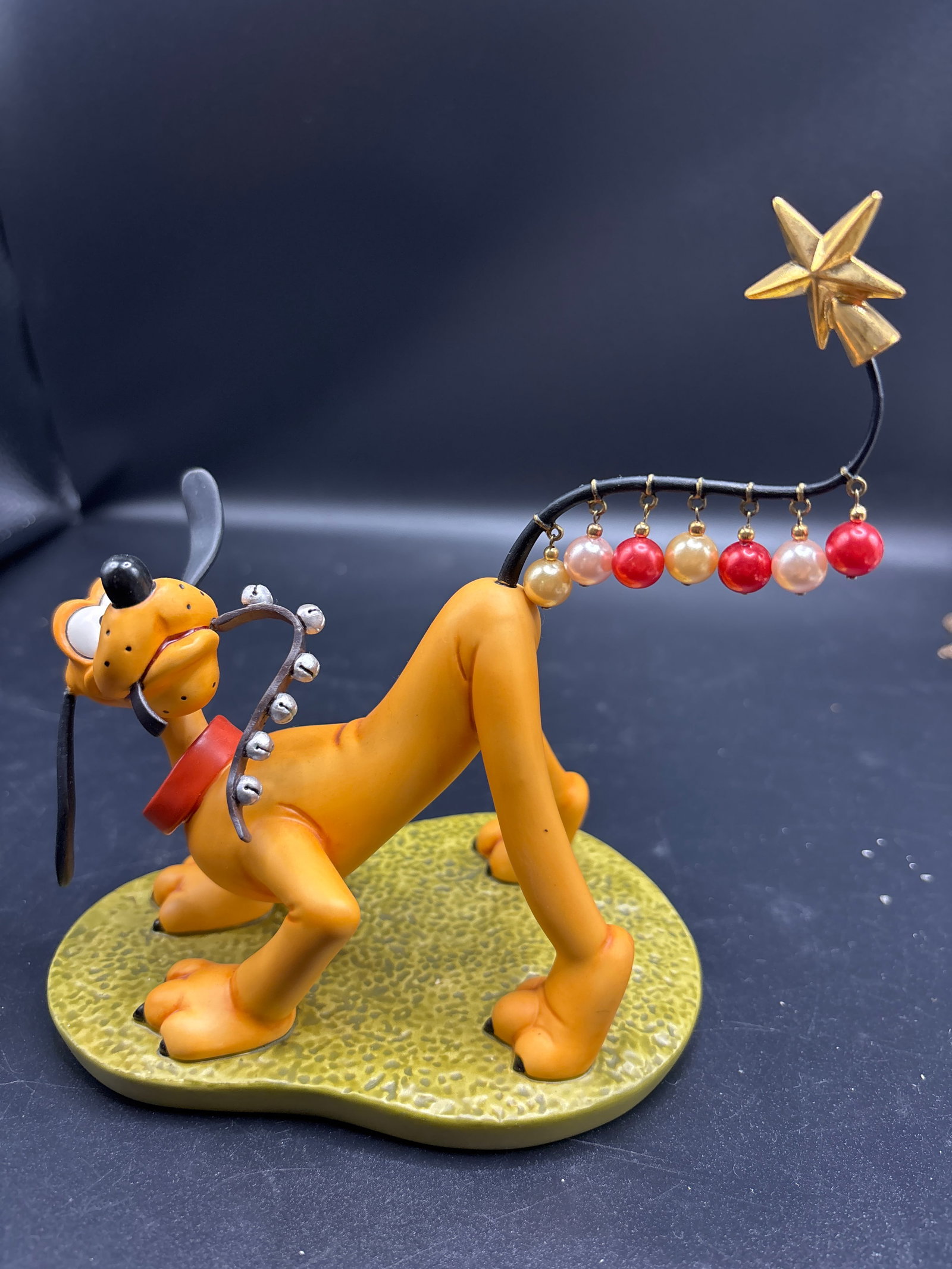 Walt Disney Classics Collection (WDCC) figurine titled "Pluto Helps Decorate’ (1 of 7)