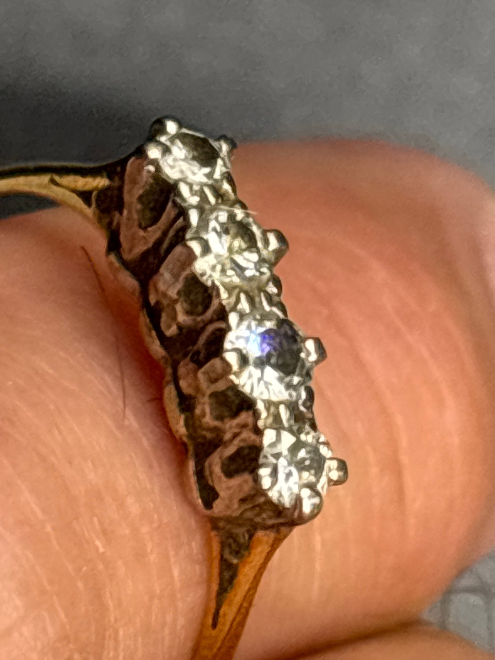 vintage 2.16 grams 18 k gold ring features three diamonds: vintage 2.16 grams 18 k gold ring features .16 ct total diamond weight three diamonds in a traditional trilogy design.Material: 18-carat yellow gold.Design: Three-stone trilogy setting, often with dia