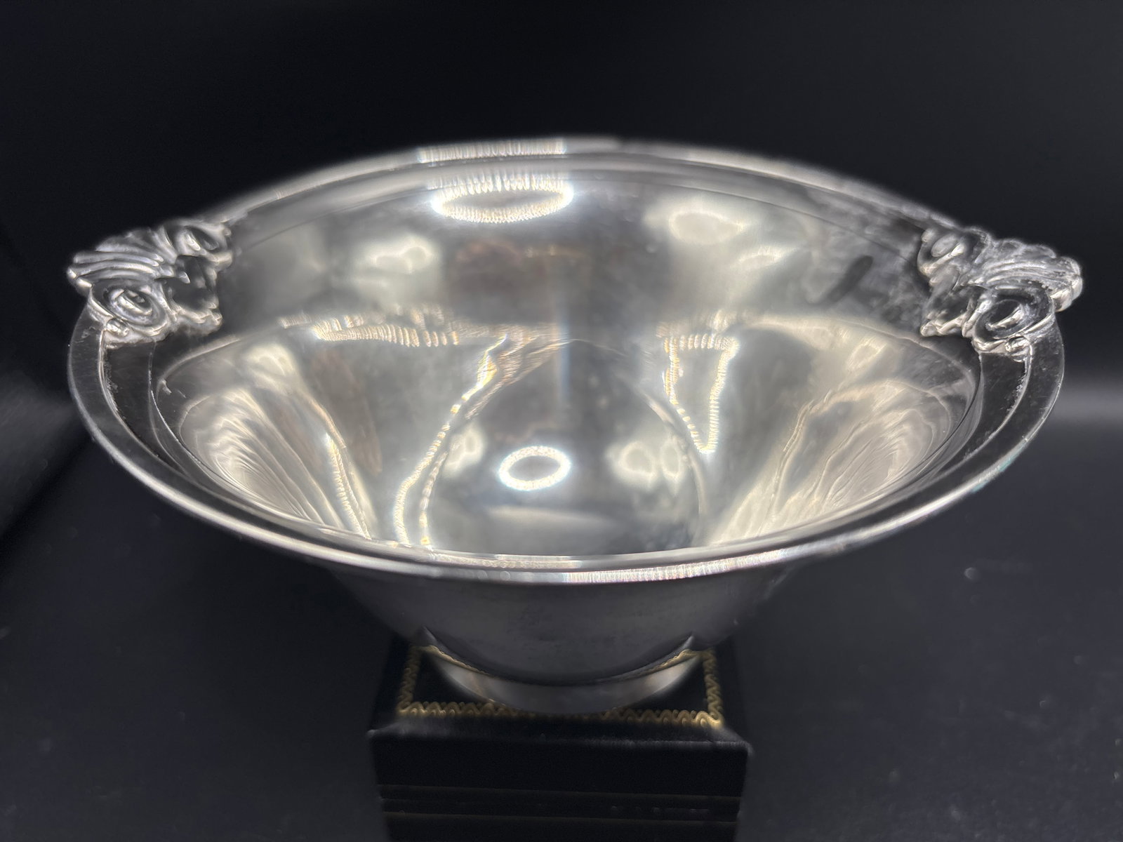 277 grams antique Tiffany & Co. sterling silver 7 inch ornate shell-and-scroll motif bowl/vase: Heavy and solid Tiffany & Co. sterling silver serving bowl featuring ornate shell-and-scroll motif handles.Design FeaturesForm: A flared, footed round bowl reminiscent of classic Paul Revere style pro