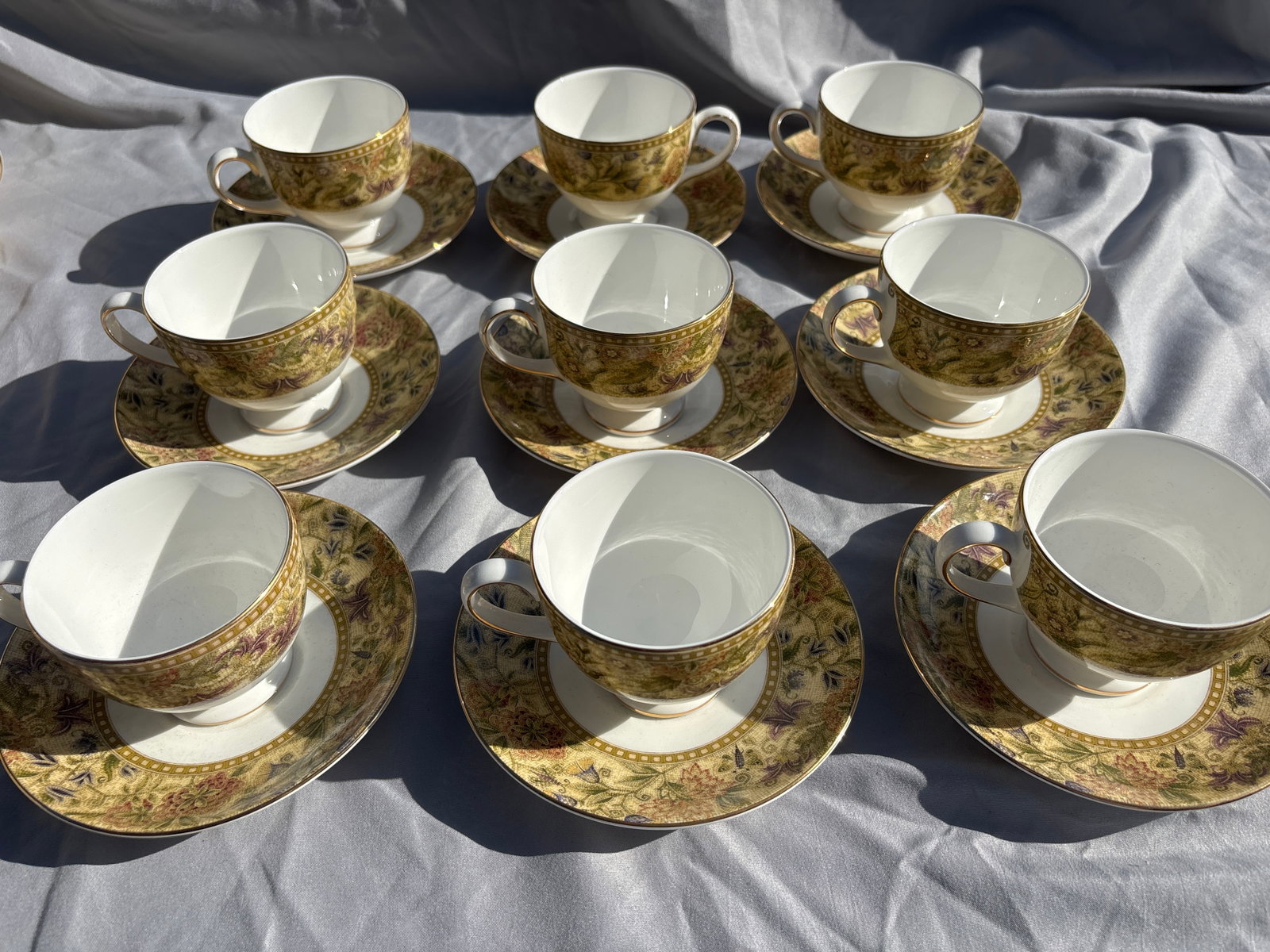 Set of nine Wedgwood Floral Tapestry pattern fine bone china tea cups with saucers: Set of nine fine bone china tea cups with saucers featuring the Wedgwood Floral Tapestry pattern.Pattern DetailsManufacturer: Produced by the renowned British company Wedgwood.Production Era: This spe