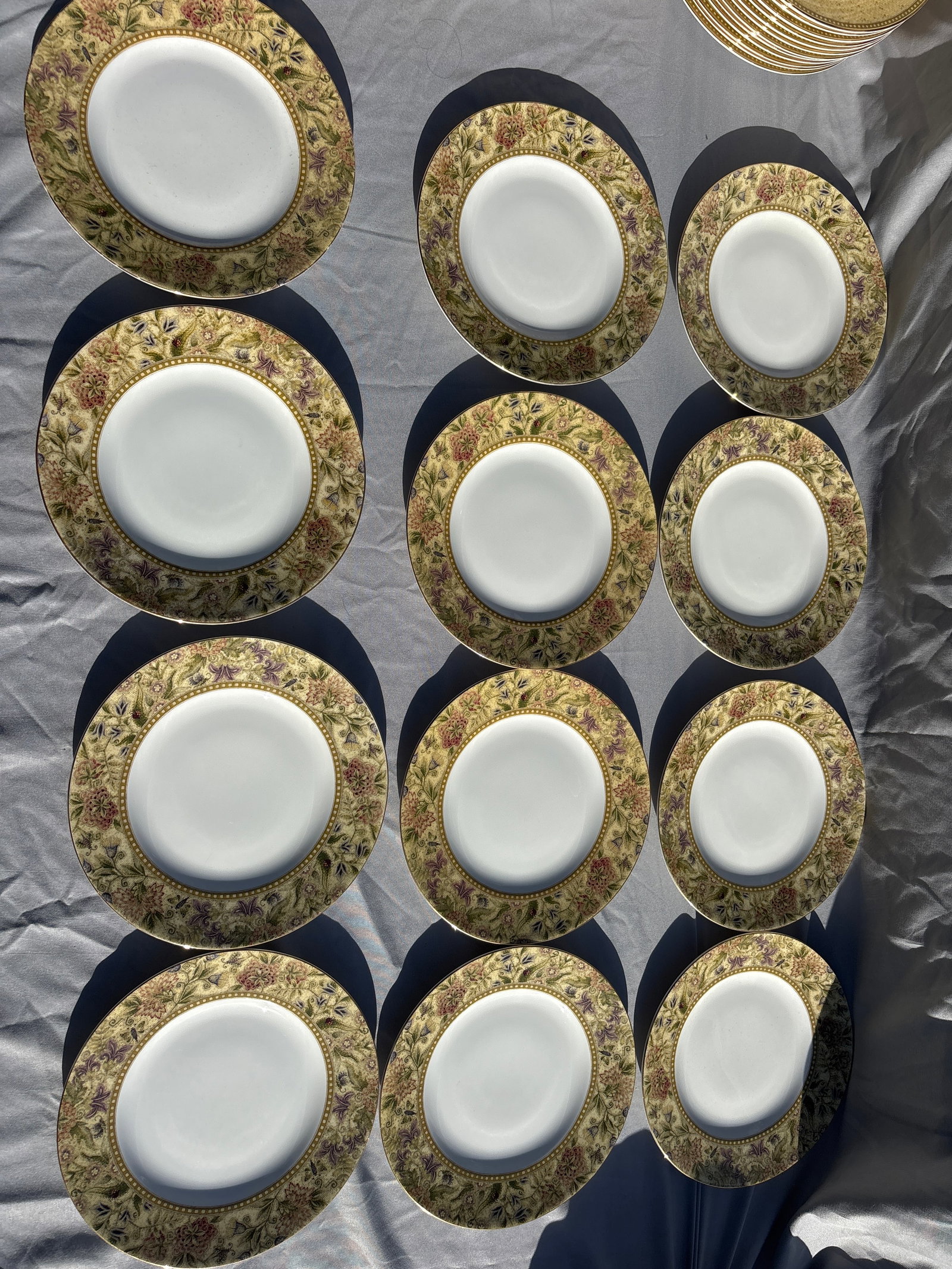 Set of twelve Wedgwood Floral Tapestry 8&1/8 inch Plates: Set of twelve Wedgwood Floral Tapestry 8&1/8 inch Plates crafted from fine bone china in England.Pattern Details: Features a textured olive and sage green border with multicolored floral sprays,