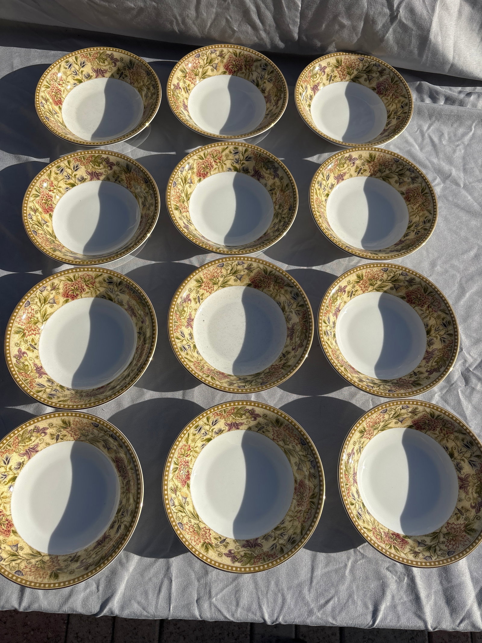 Set of twelve Wedgwood Floral Tapestry 6 inch side bowls: Set of twelve Wedgwood Floral Tapestry 6 inch side bowls crafted from fine bone china in England.Pattern Details: Features a textured olive and sage green border with multicolored floral sprays,