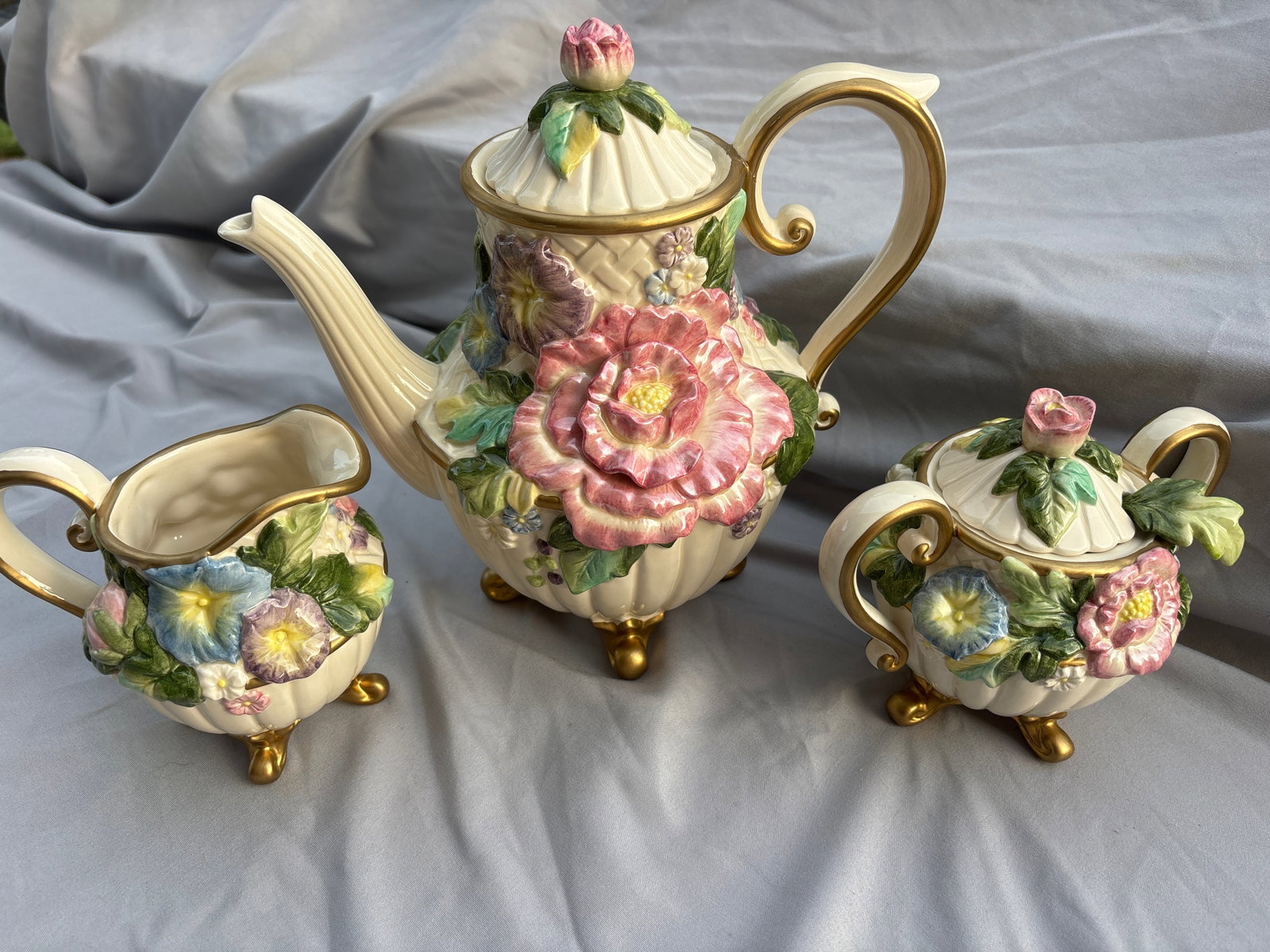 Fitz and Floyd "Les Fleurs" ceramic coffee/tea service set: Damage to the handle. Fitz and Floyd "Les Fleurs" ceramic coffee/tea service set including sugar spoon. Released in the 1990s, this highly collectible, hand-painted Majolica-style pattern features 3D