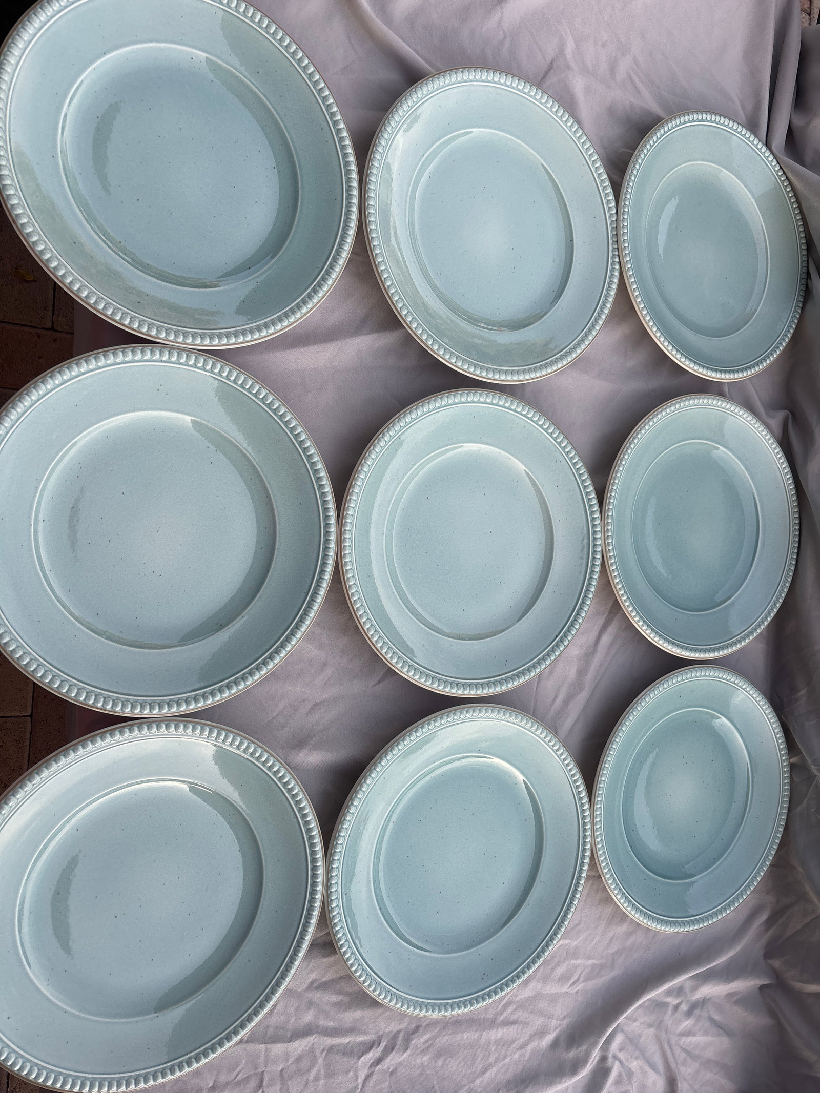 Set of nine Villeroy & Boch "Switch Beach House-Water’ 11&1/8 inch plates: Villeroy & Boch "Switch Beach House" collection, specifically in the "Water" pattern variant.This specific piece is the light blue/aqua dinner plate featuring a distinct beaded relief border and a sub