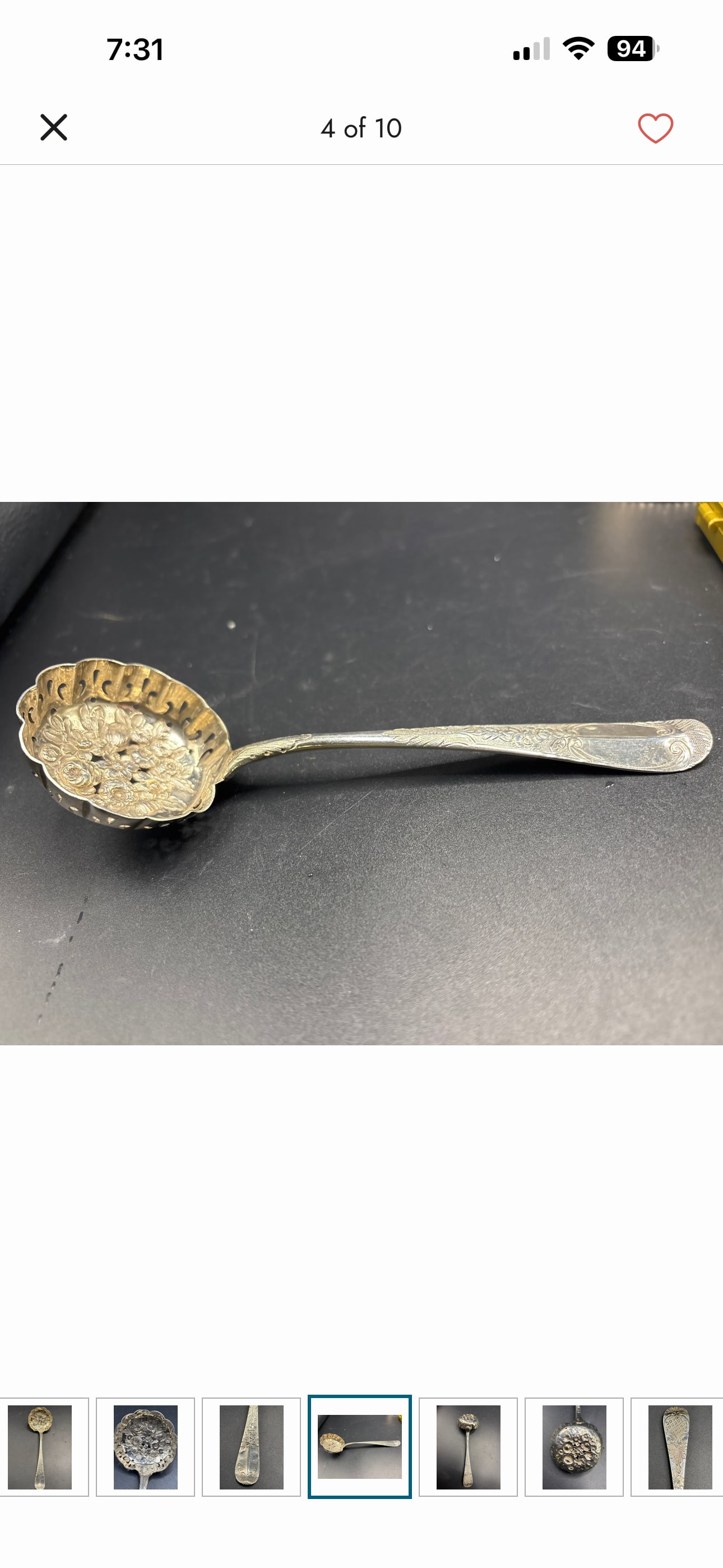 57 grams Georgian silver 7 inch serving spoon; possibly John Wrenn I, London 1750: 57 grams, floral, makers mark worn, possibly John Wrenn I, London 1750 . It features a scalloped, pierced bowl decorated with floral or fruit motifs and an engraved handle.These spoons were commonly u
