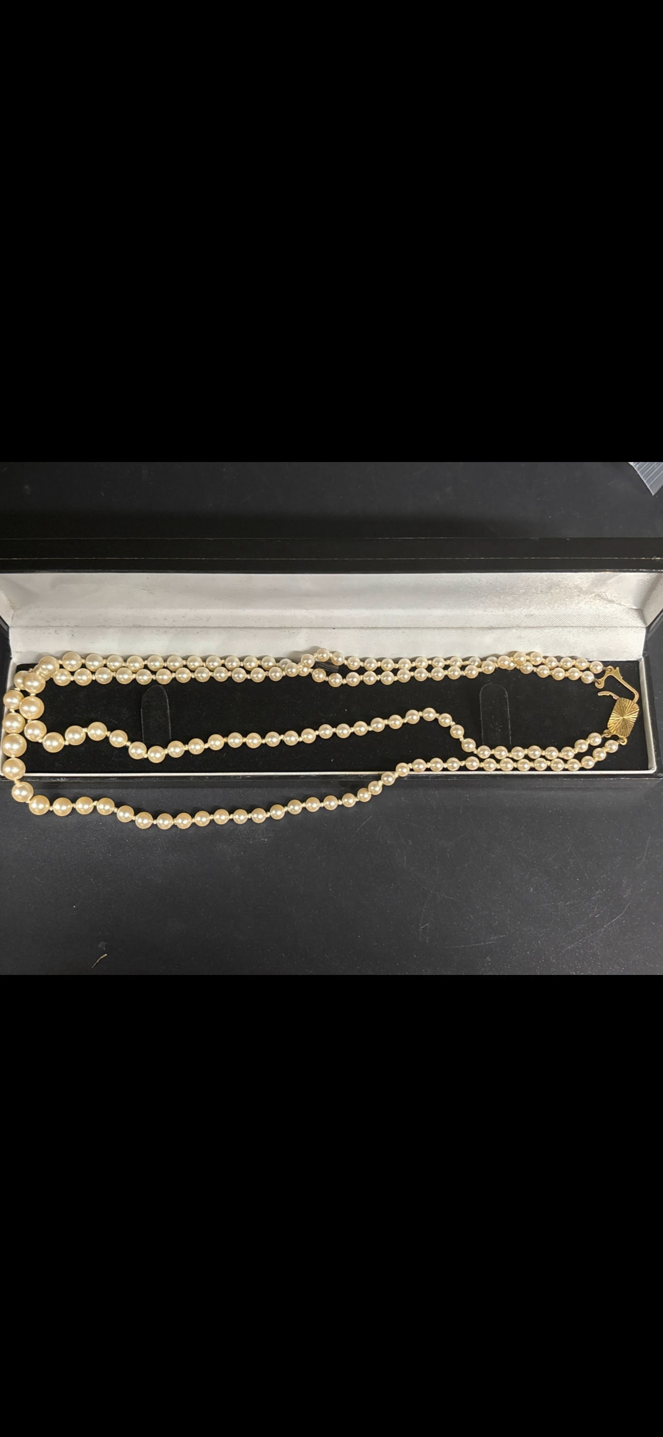 Vintage English 9ct yellow gold clasp double-strand cultured pearl necklace: double-strand cultured pearl necklace with a 9-karat (9k / .375) yellow gold clasp arranged in a presentation case.Value and Identification GuideThe overall market value for vintage double-strand pear