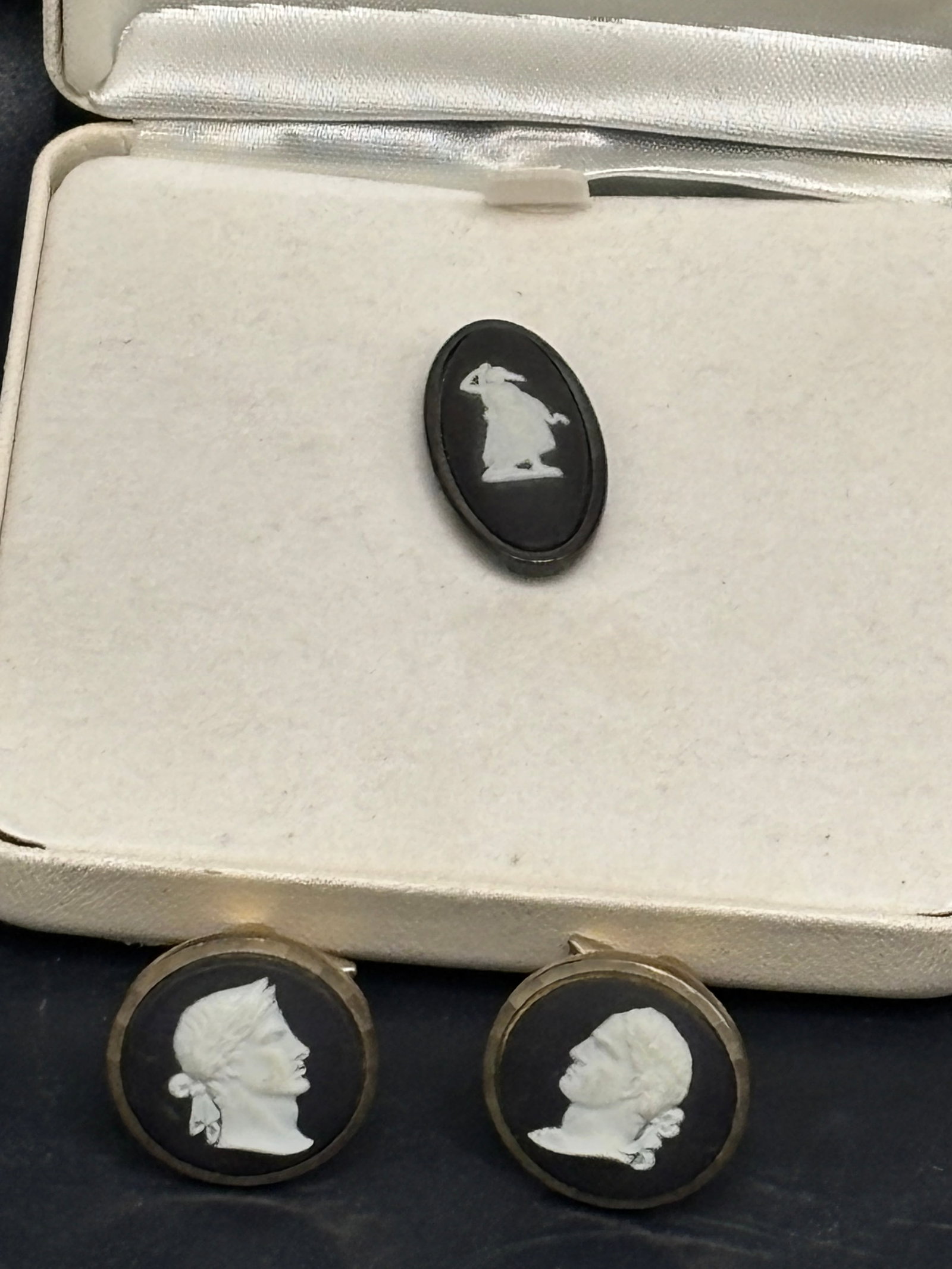 Three pieces vintage Wedgwood black jasperware neoclassical: Three pieces vintage Wedgwood black jasperware neoclassical; cameo brooch featuring a white relief of the Greek goddess HygieiaWedgwood cufflinks feature classic neoclassical white bas-relief cameo pr