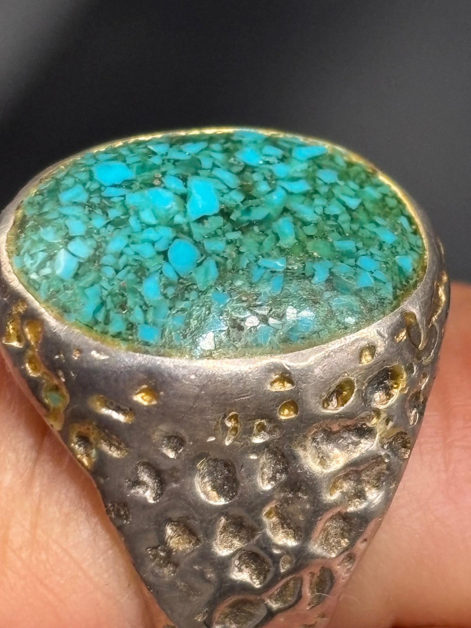 vintage sterling Native American turquoise ring: handcrafted Native American sterling silver ring features a textured tufa cast band and an oval green-blue turquoise stone. Approximate size 8-9