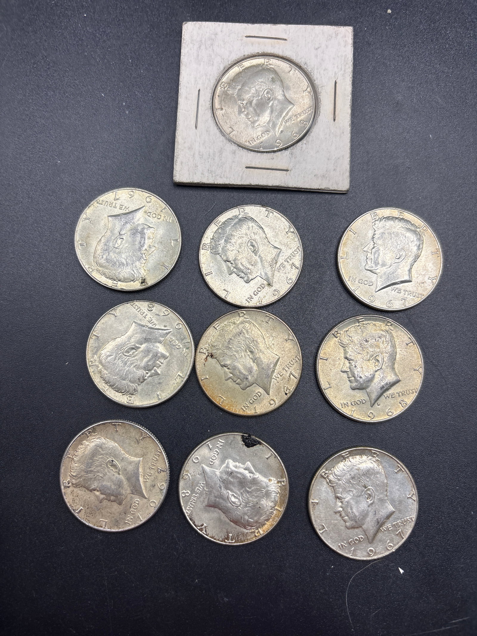 1.5 Troy Ounces 40% sikver Kennedy half dollars: Ten US Kennedy Half Dollar housed in a 2x2 cardboard coin flip. This coin is part of the 40% silver composition series minted from 1965 to 1970.Coin Specifications & DetailsDenomination: 50 Cents (Hal