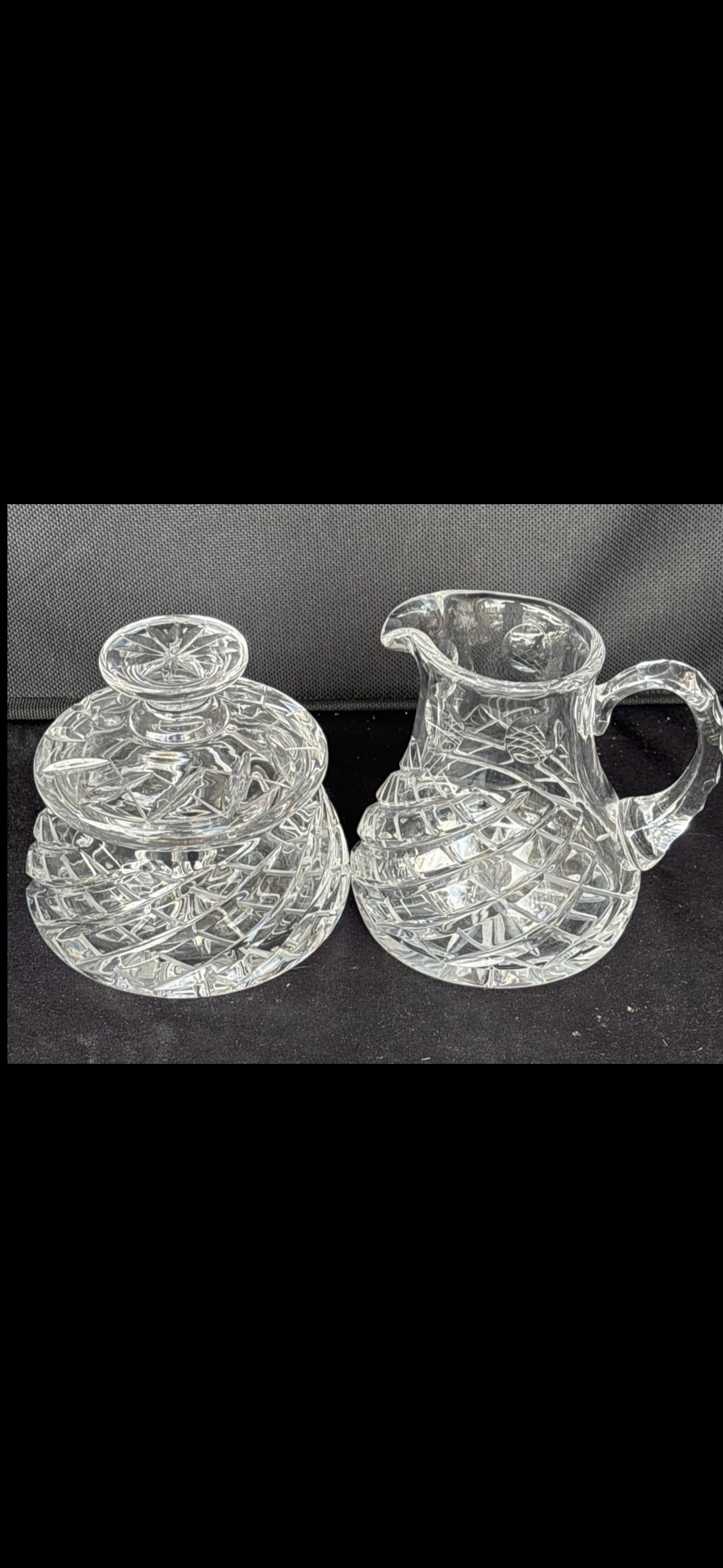 vintage Ceska (Bohemian) cut crystal Sugar & creamer: vintage Ceska (Bohemian) cut crystal tableware, highly valued for its high lead content, exceptional clarity, and intricate geometric patterns.The items shown include:A hand-cut crystal creamer pitche