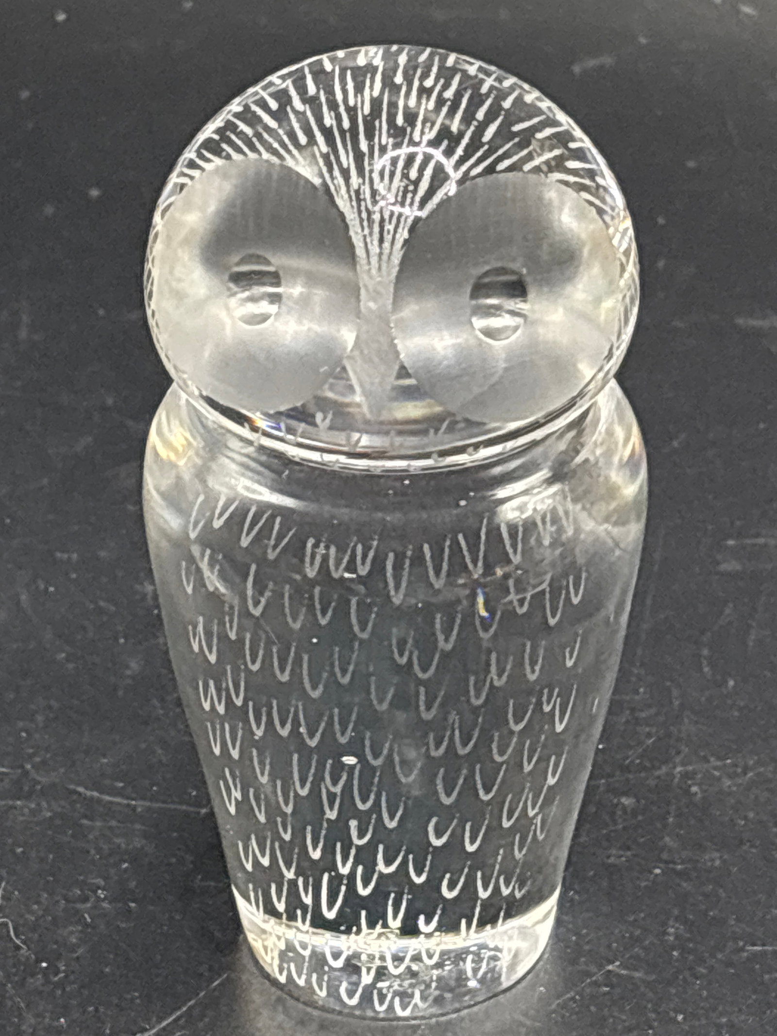 Signed vintage Kosta Boda crystal owl 3.5 inch paperweight: vintage Kosta Boda crystal owl paperweight designed by Vicke Lindstrand in Sweden during the 1960s.Design FeaturesMaterial: Clear, handblown art glass or crystal.Details: Features etched feather patte