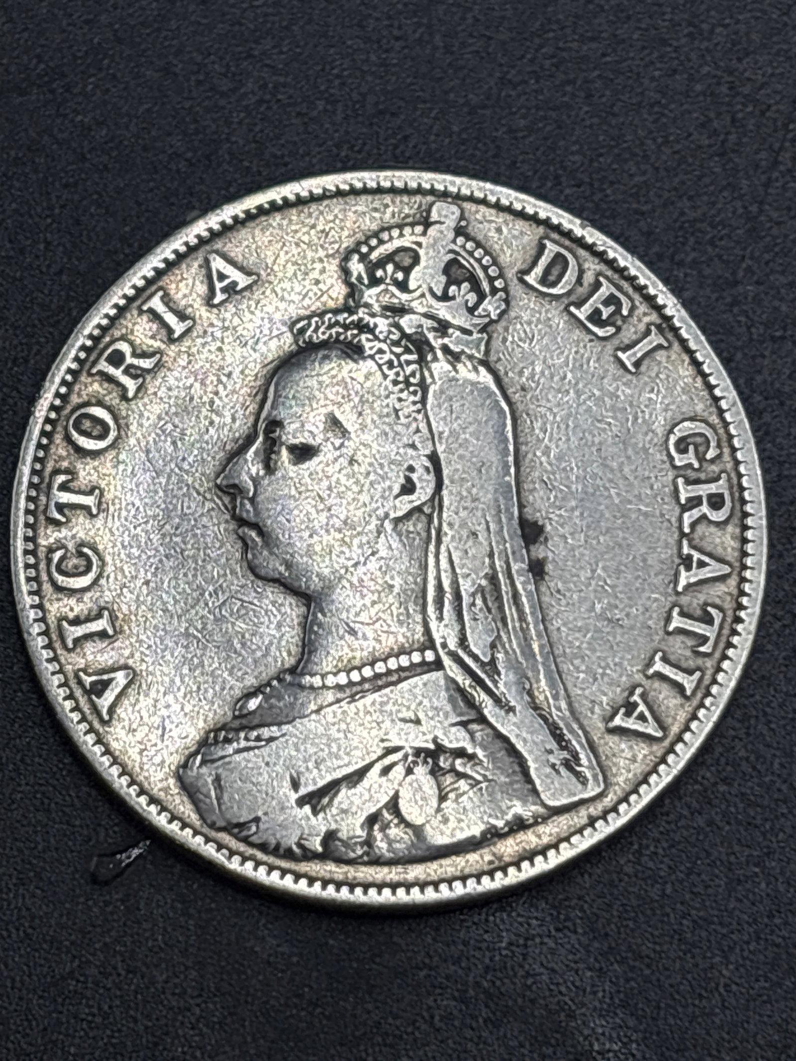 27 grams Sterling silver 19th C. Queen Victoria "Old Head" or "Widow Head" coin: 27 grams Sterling silver Queen Victoria "Old Head" or "Widow Head" silver coin from the late 19th century, potentially a Crown or Shilling.It is crafted from sterling silver (0.925 fineness) and featu