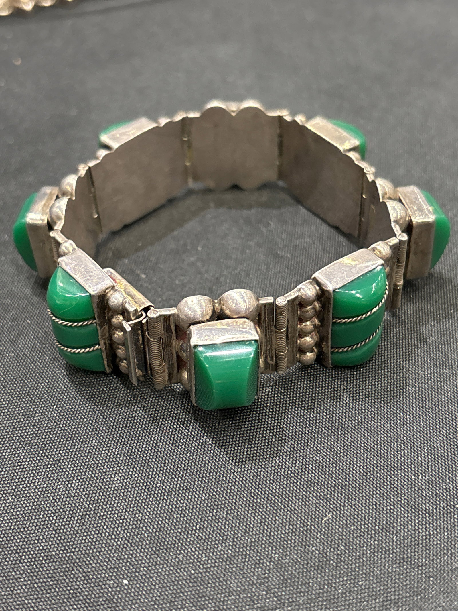 vintage Mexican sterling silver panel link bracelet; 64 grams: vintage Mexican sterling silver panel link bracelet, a classic mid-century style typically produced in prominent silver jewelry hubs like Taxco, Mexico. [1]Key Characteristics* Design Era: Most likely