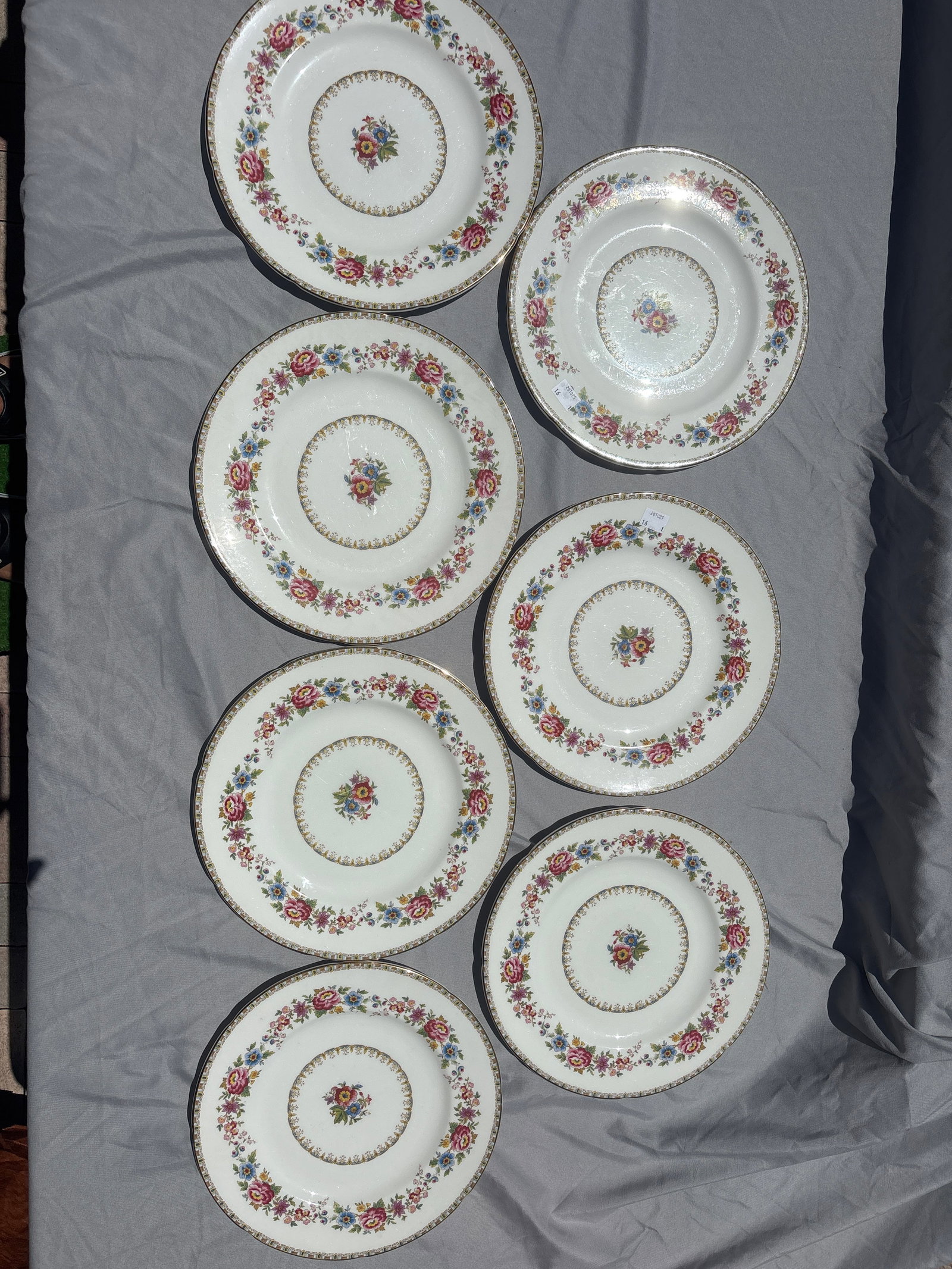 Seven vintage Royal Grafton Malvern bone china 10&5/8 inch dinner plates: Seven vintage Royal Grafton Malvern bone china dinner plates, identified by its colorful floral pattern and delicate gilt trim.Crafted in England, this pattern features vibrant multi-colored flowers a