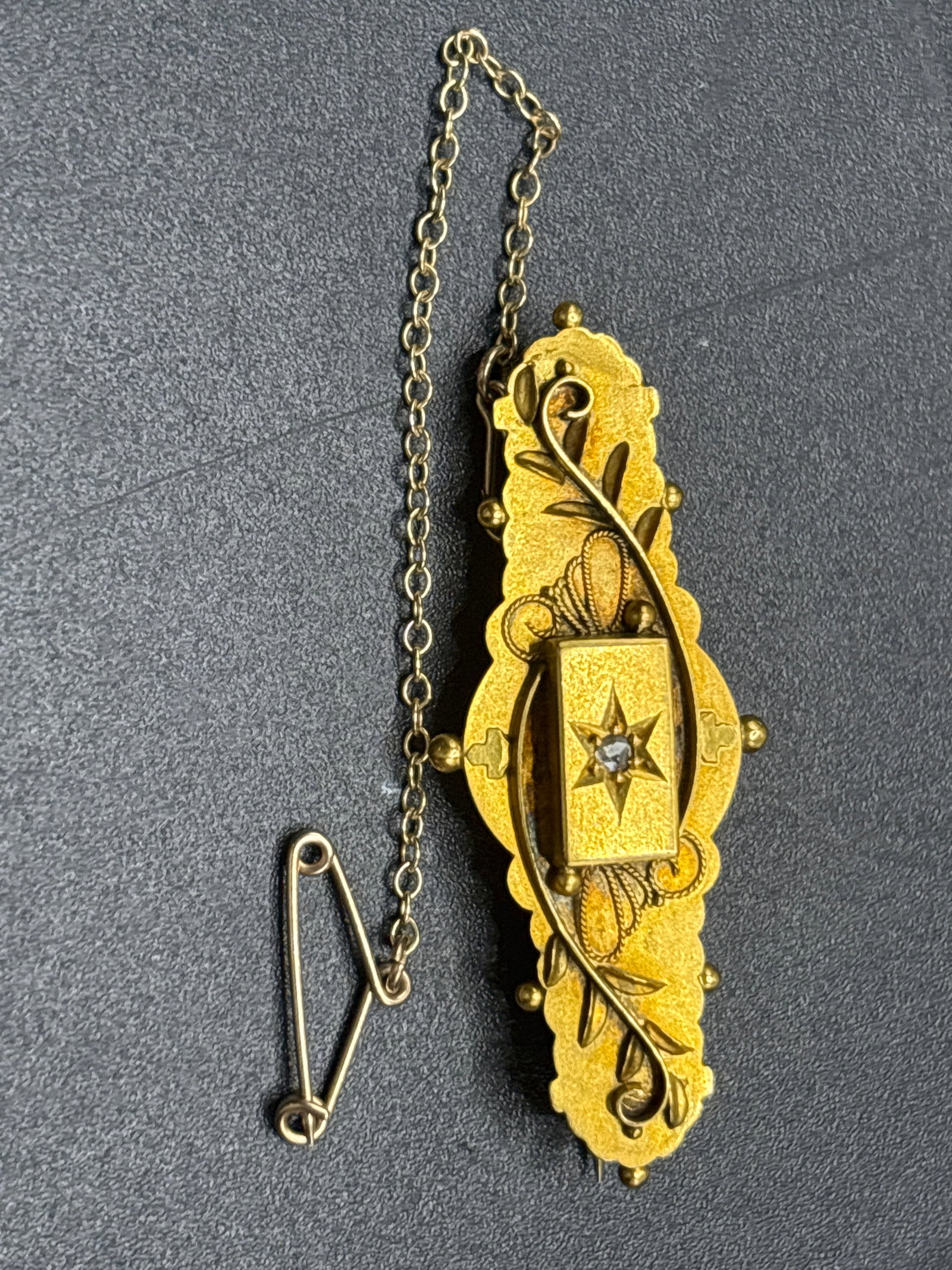 3.61 grams 9 k Victorian/Edwardian Etruscan Revival bar brooch: 3.61 grams 9 k authentic antique Victorian Etruscan Revival bar brooch, commonly dating from the late 19th century (circa 1880–1900) to the early Edwardian period. [1, 2, 3]The piece is crafted from