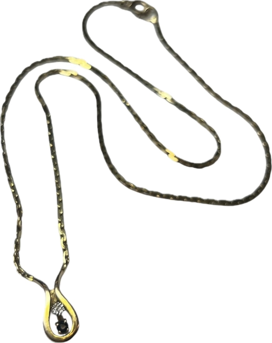 6.16 grams 9k gold necklace chain w/ integral diamond & sapphire set wishbone shaped pendant: A 9k gold necklace chain with integral diamond and sapphire set wishbone shaped pendant, marked '9k' to clasp, 23cm long