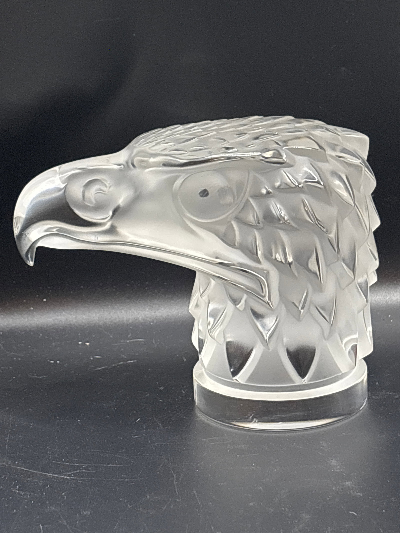 5 inch authentic Lalique crystal "Tête Lalique crystal "Tête d'Aigle" (Eagle Head) sculpture: Lalique crystal "Tête Lalique crystal "Tête d'Aigle" (Eagle Head) sculpture, which was originally designed in 1928 by the renowned French glassmaker René Lalique. It features stylized, clear, and f