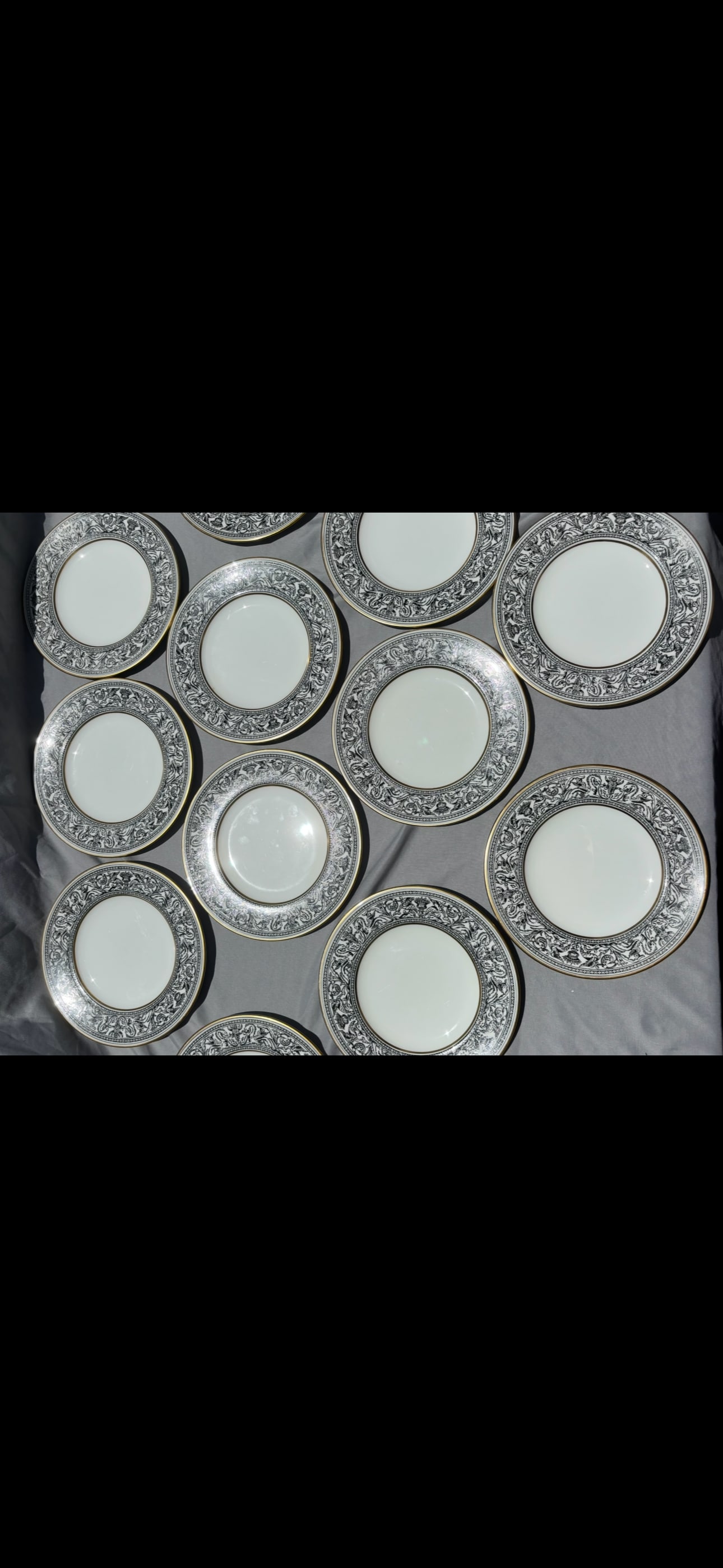 Set of twelve Wedgwood Florentine Black pattern 6 inch bread plates: This stunning fine china set is the Wedgwood Florentine Black pattern, specifically featuring the ornate "Black Dragons" design (pattern code W4312) trimmed in a brilliant gold gilt.Introduced mid-cen