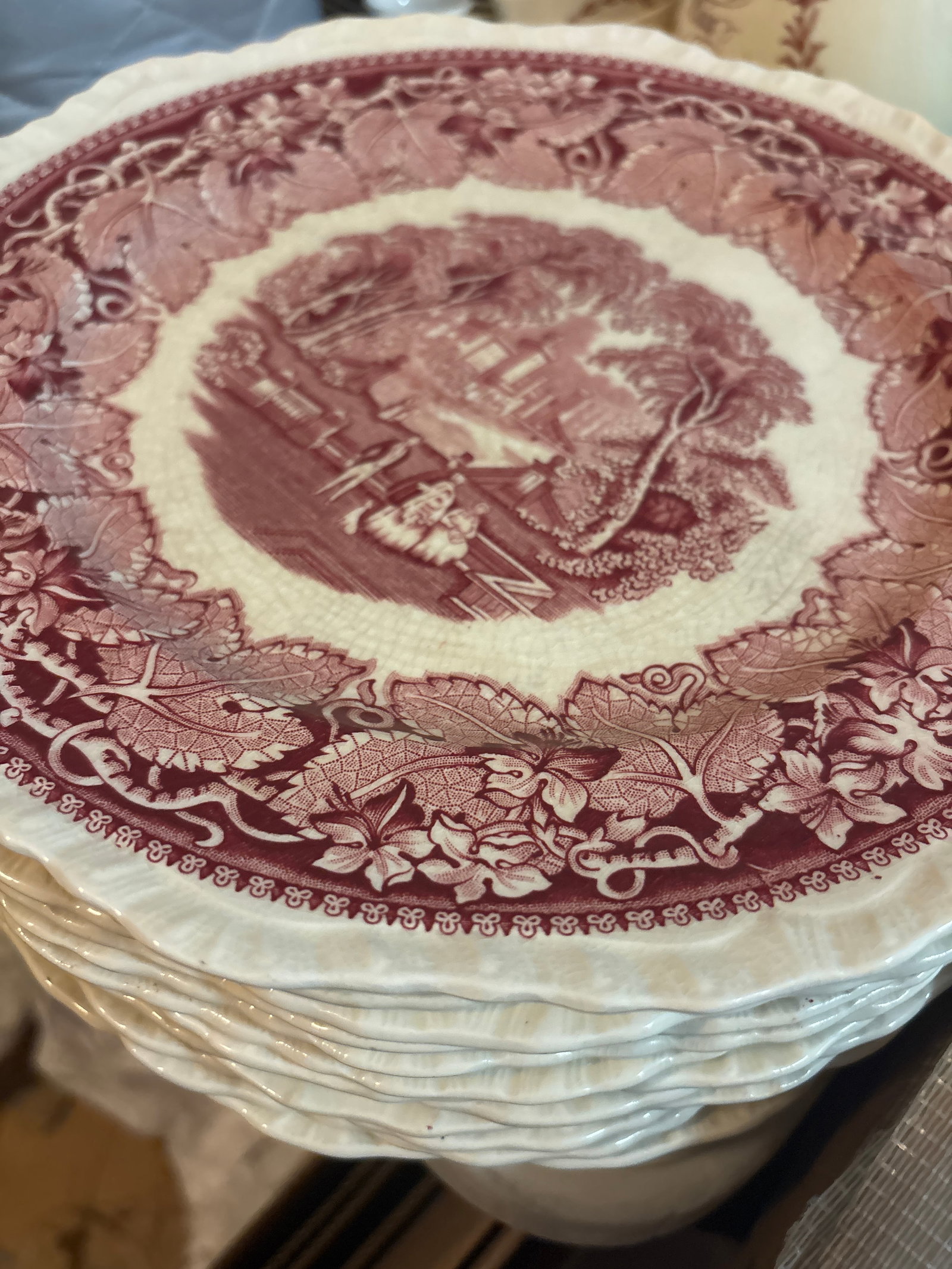Set of twelve vintage Mason's Vista Red/Pink Transferware Ironstone Plates: Set of twelve vintage Mason's Vista Red/Pink Transferware Ironstone Plates made in England, featuring a classical English landscape design with a scalloped rim and grape leaf border. What size the pla