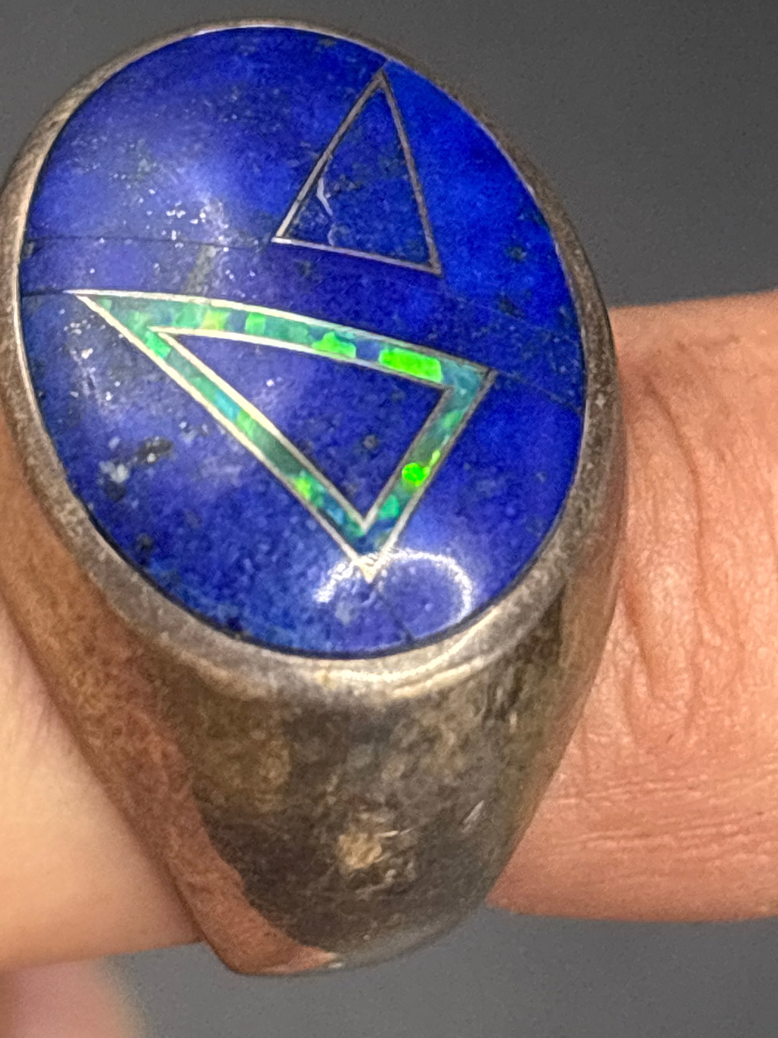 vintage sterling silver Native American-style lapis lazuli ring: vintage Native American-style sterling silver ring featuring an oval lapis lazuli inlay accented with triangular opal details. : RingMaterial: Sterling silver with lapis and opal inlayStyle: Southwest