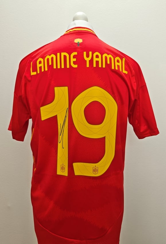 Lamine Yamal Signed Spain 2024 Home Shirt #19 (ICONS Authenticated): Spain 2024 home jersey, signed by Lamine Yamal. The red shirt features his name and number 19 on the back, with the signature placed on the number. Included is an ICONS certificate of authenticity cer