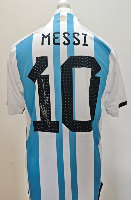 Lionel Messi Signed Argentina 2022-2023 Home Shirt #10 (ICONS Authenticated): Argentina 2022-2023 home jersey, signed by Lionel Messi. The sky blue and white striped shirt features his name and number 10 on the back, with the signature placed on the number. Included is an ICONS