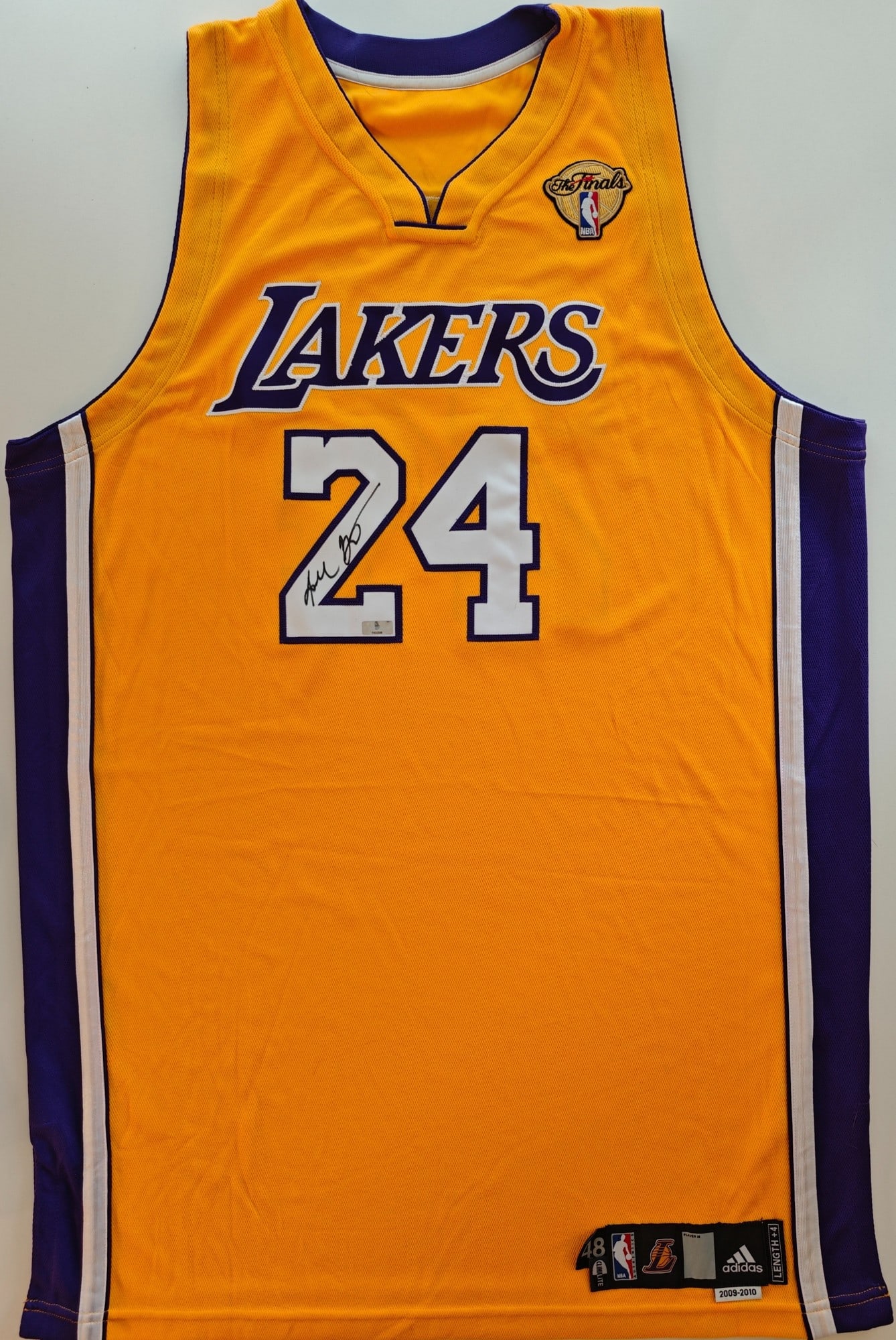 Kobe Signed Lakers Finals Jersey, Panini COA: Kobe Bryant (1978-2020), "Los Angeles Lakers 2009-2010 Finals jersey (Adidas)", signed on the front number 24. Authenticated by Panini, certification no. PA32588.
